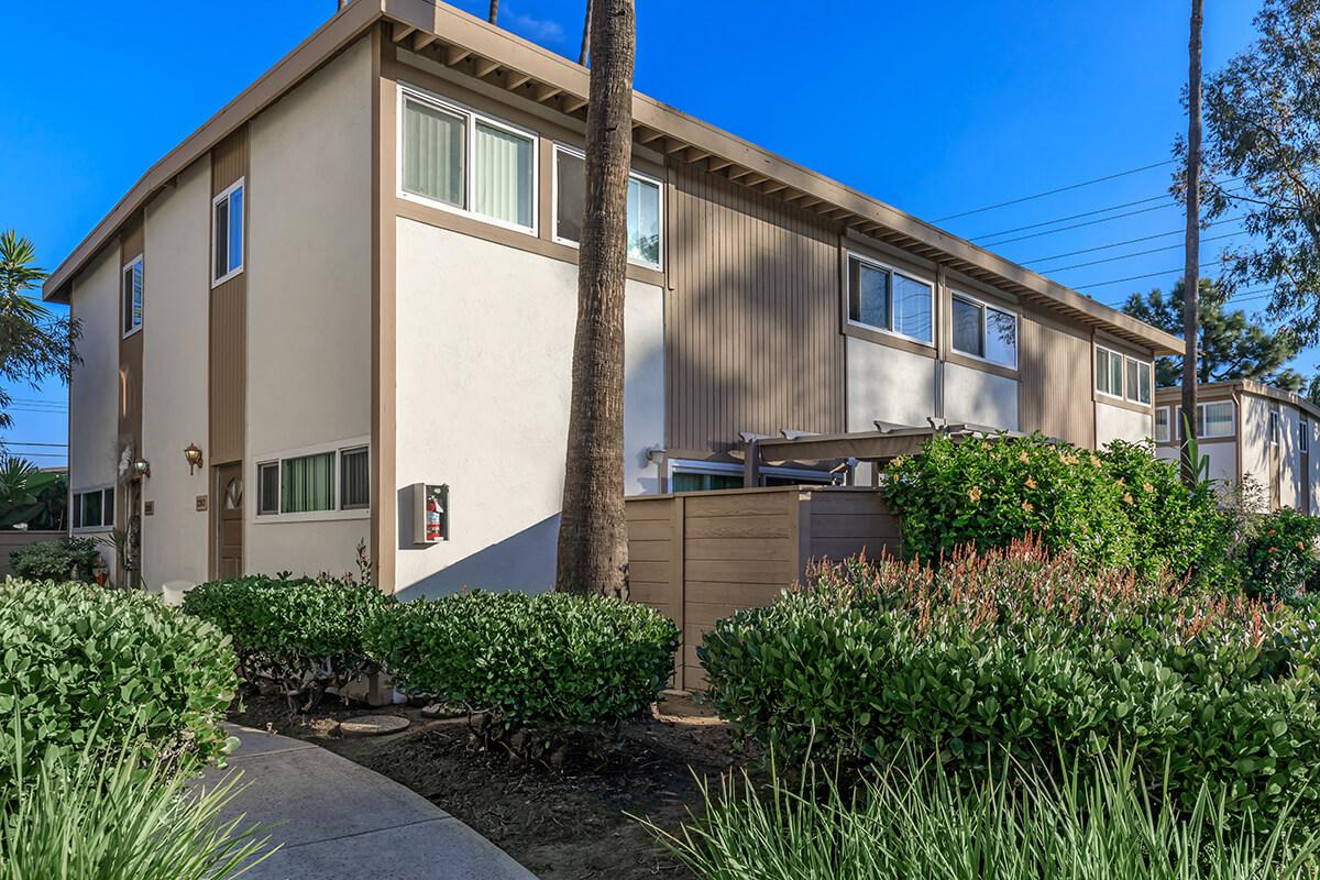 Sea Breeze Rental Townhomes community building surround by green bushes