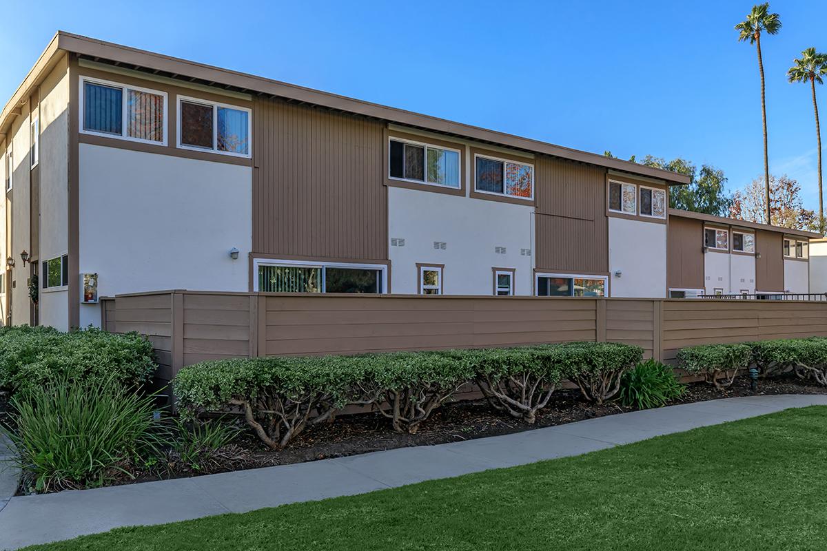 Sea Breeze Rental Townhomes community building with wooden fence