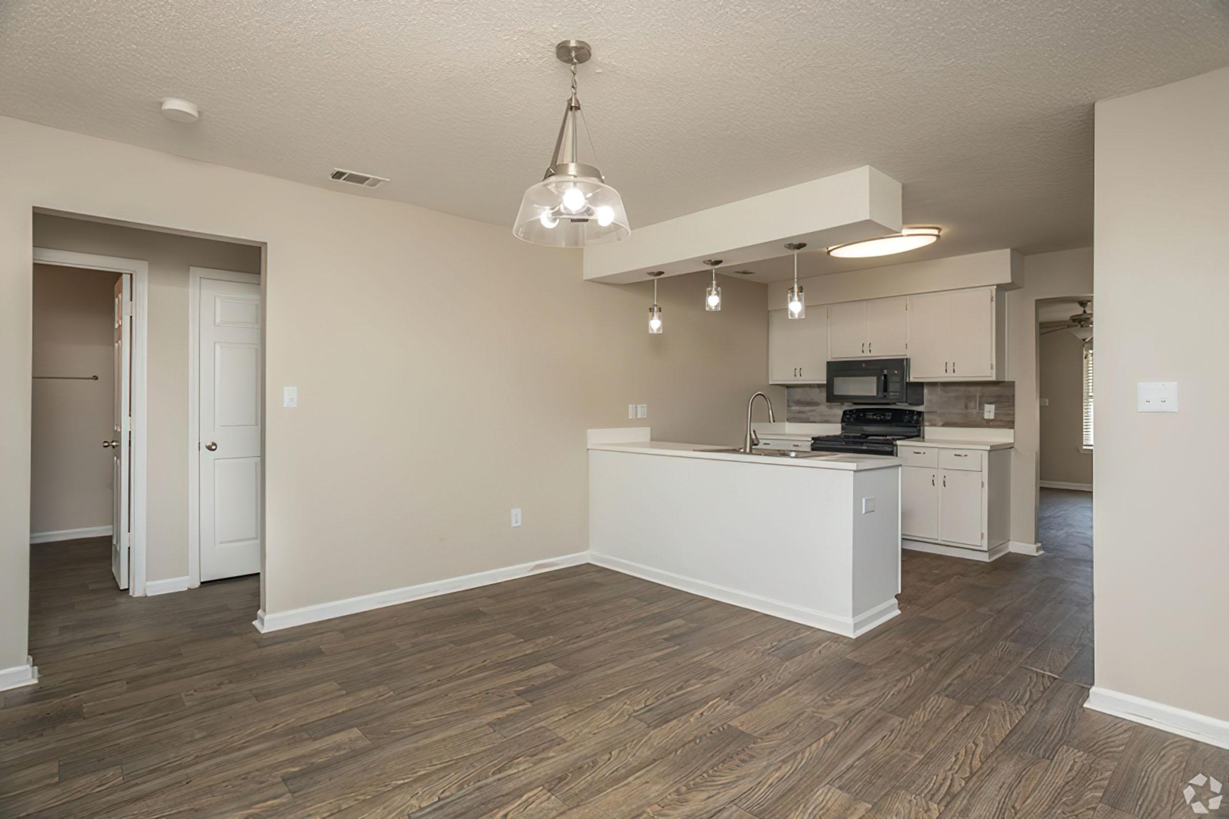 a kitchen with a sink and a refrigerator