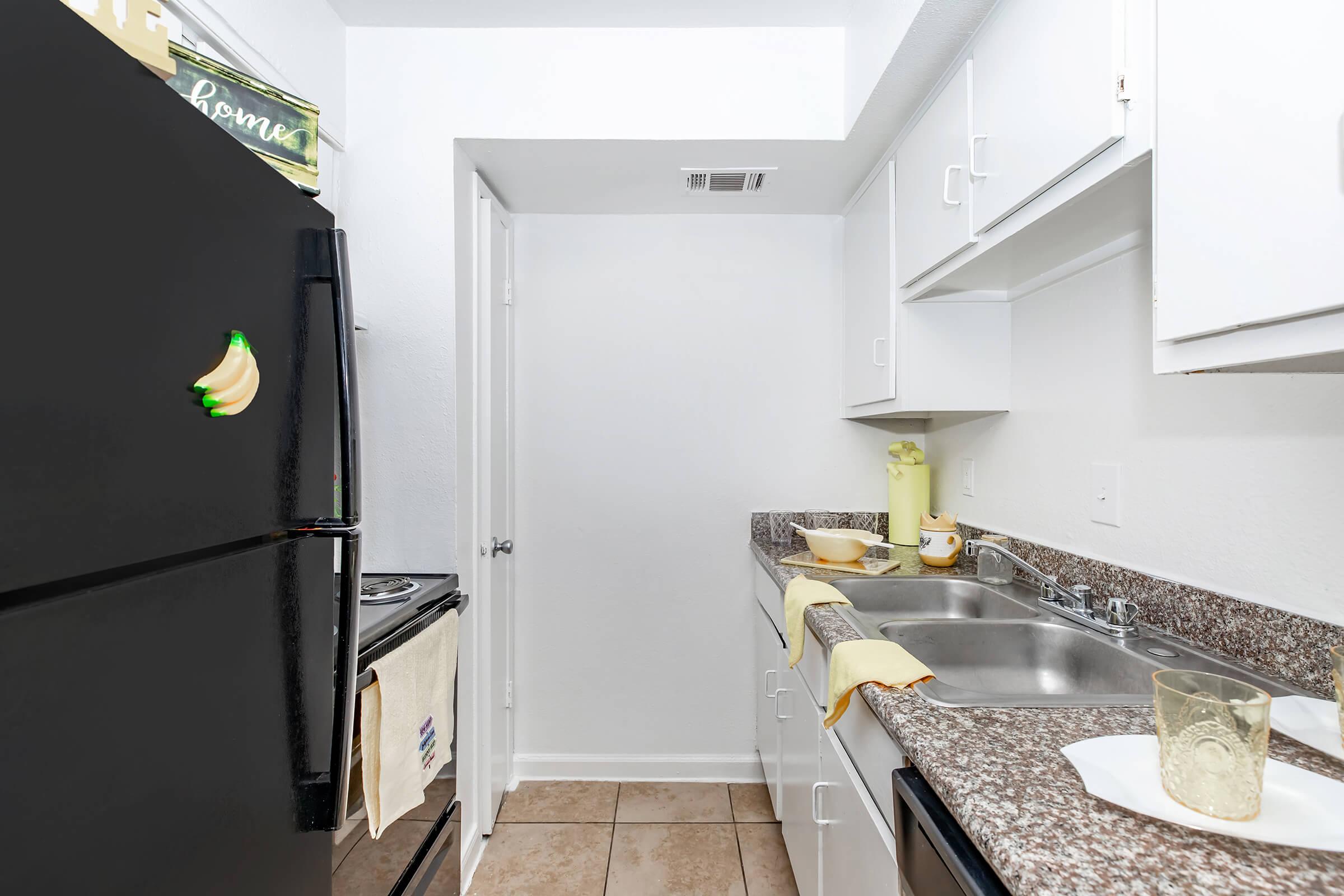 a stainless steel refrigerator in a kitchen