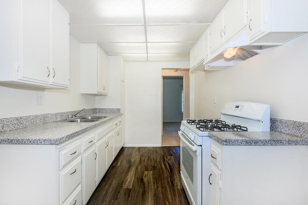 a kitchen with a stove top oven
