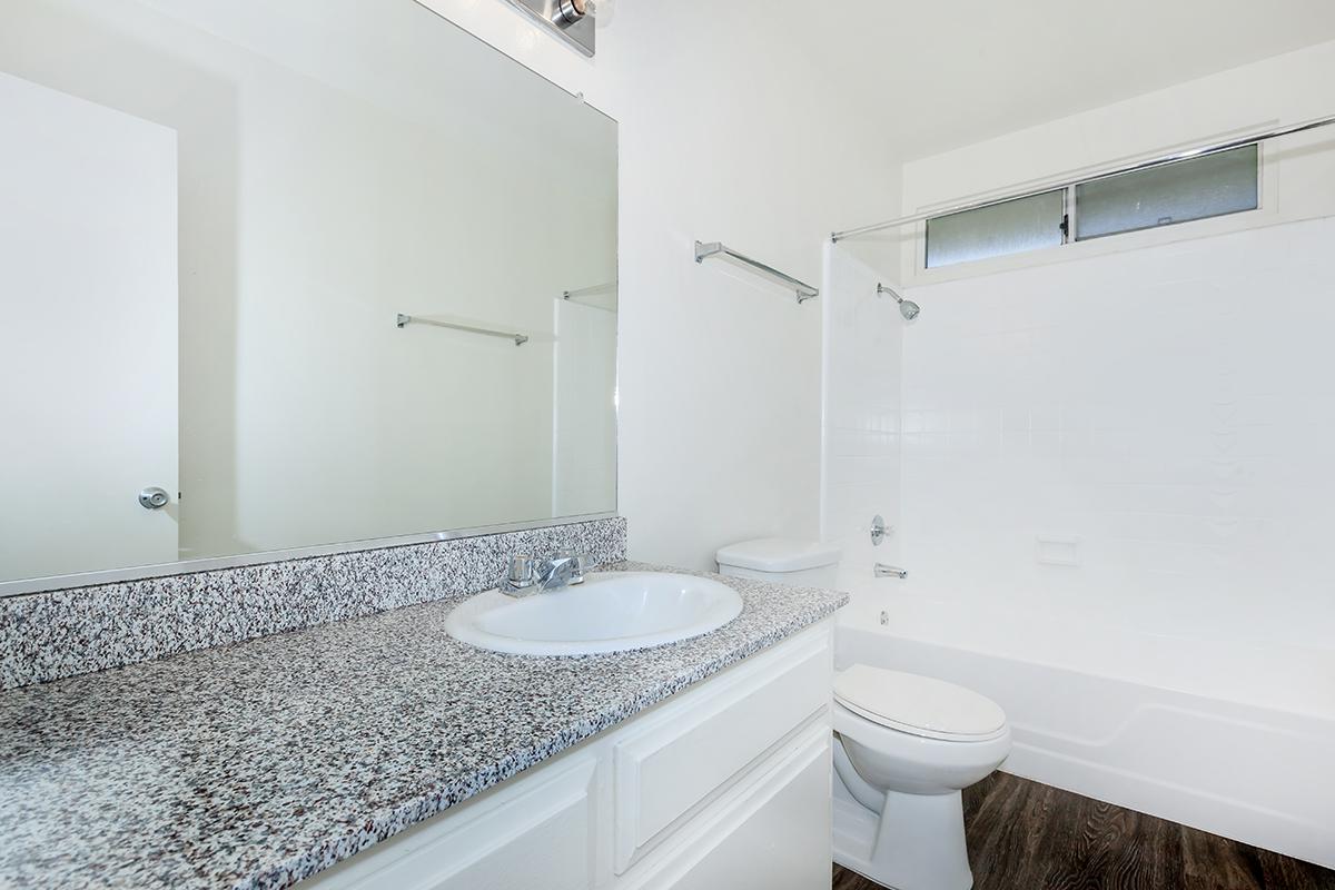 a room with a sink and a mirror