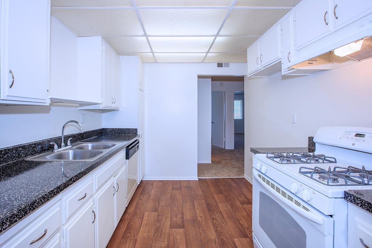 a kitchen with a stove top oven