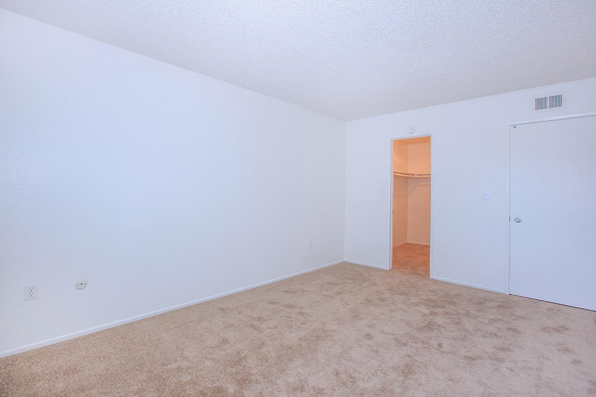 a bedroom with a bed in a room