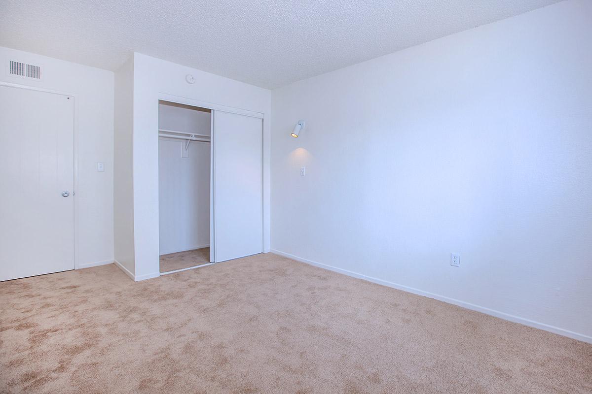 a bedroom with a bed in a room