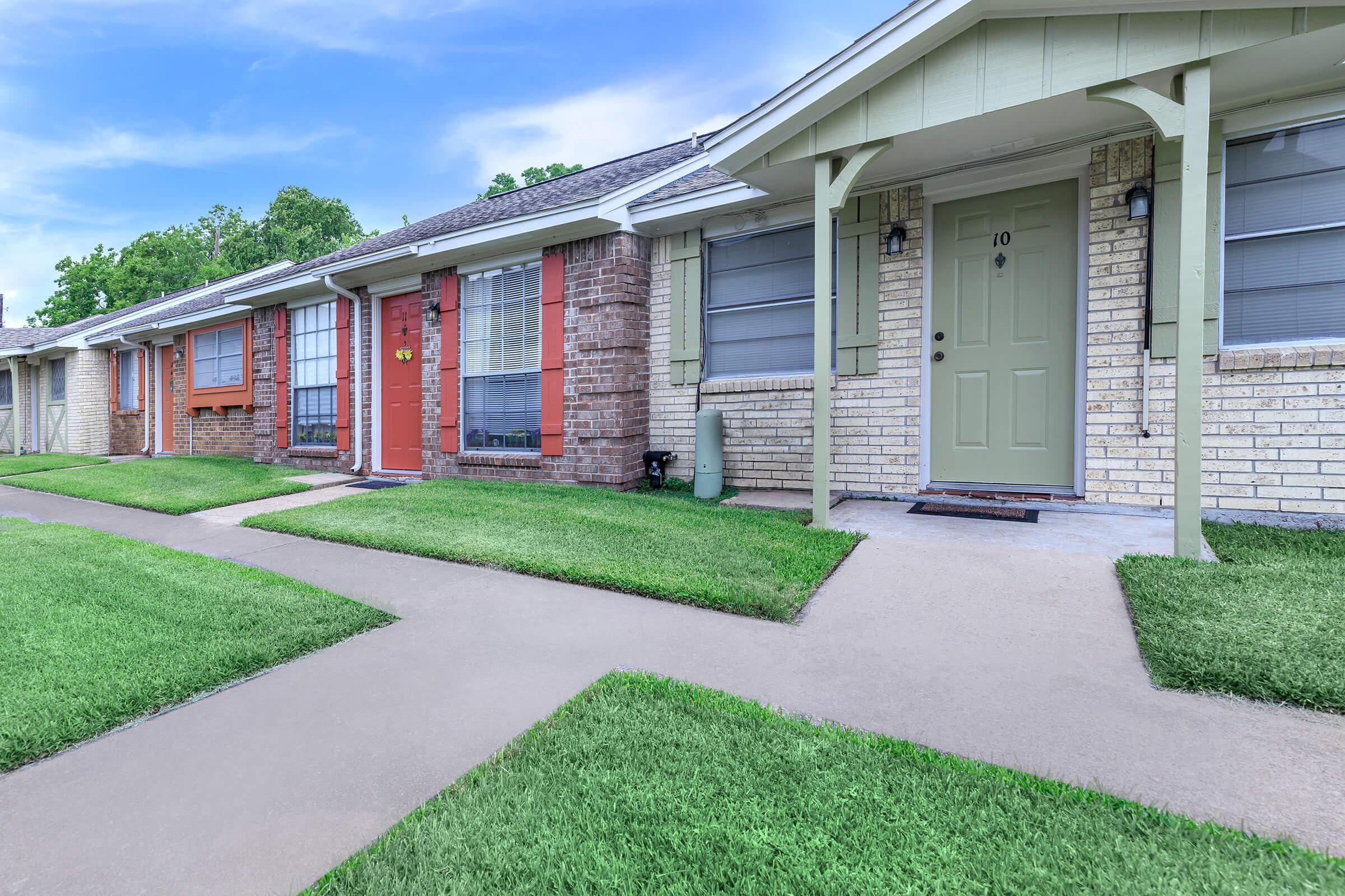 a large lawn in front of a house