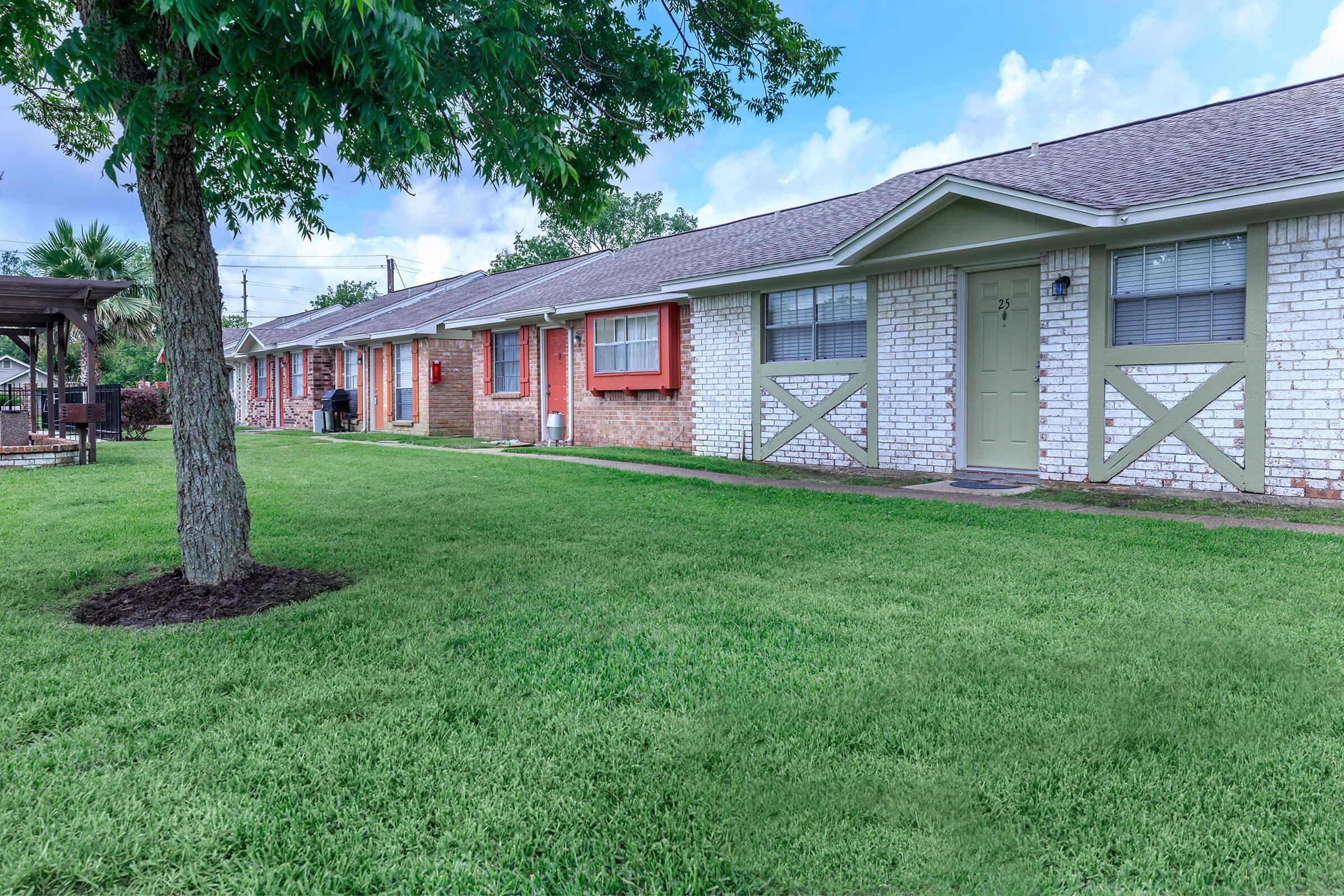 a large lawn in front of a house