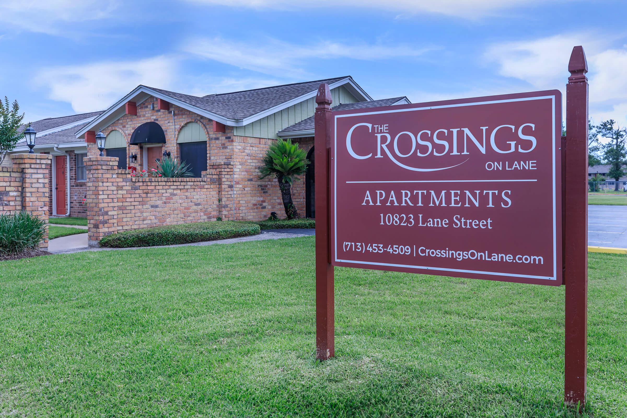 a sign in front of a house