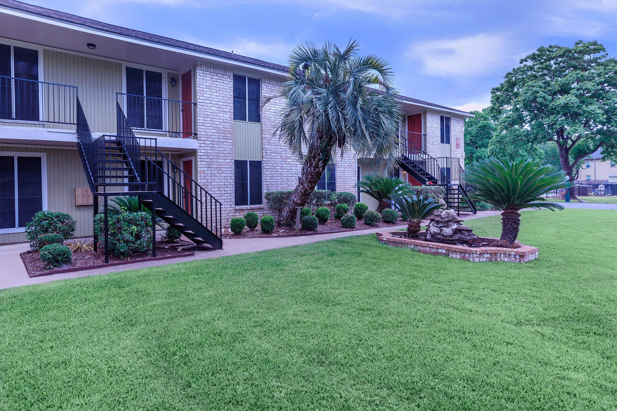 a large lawn in front of a house