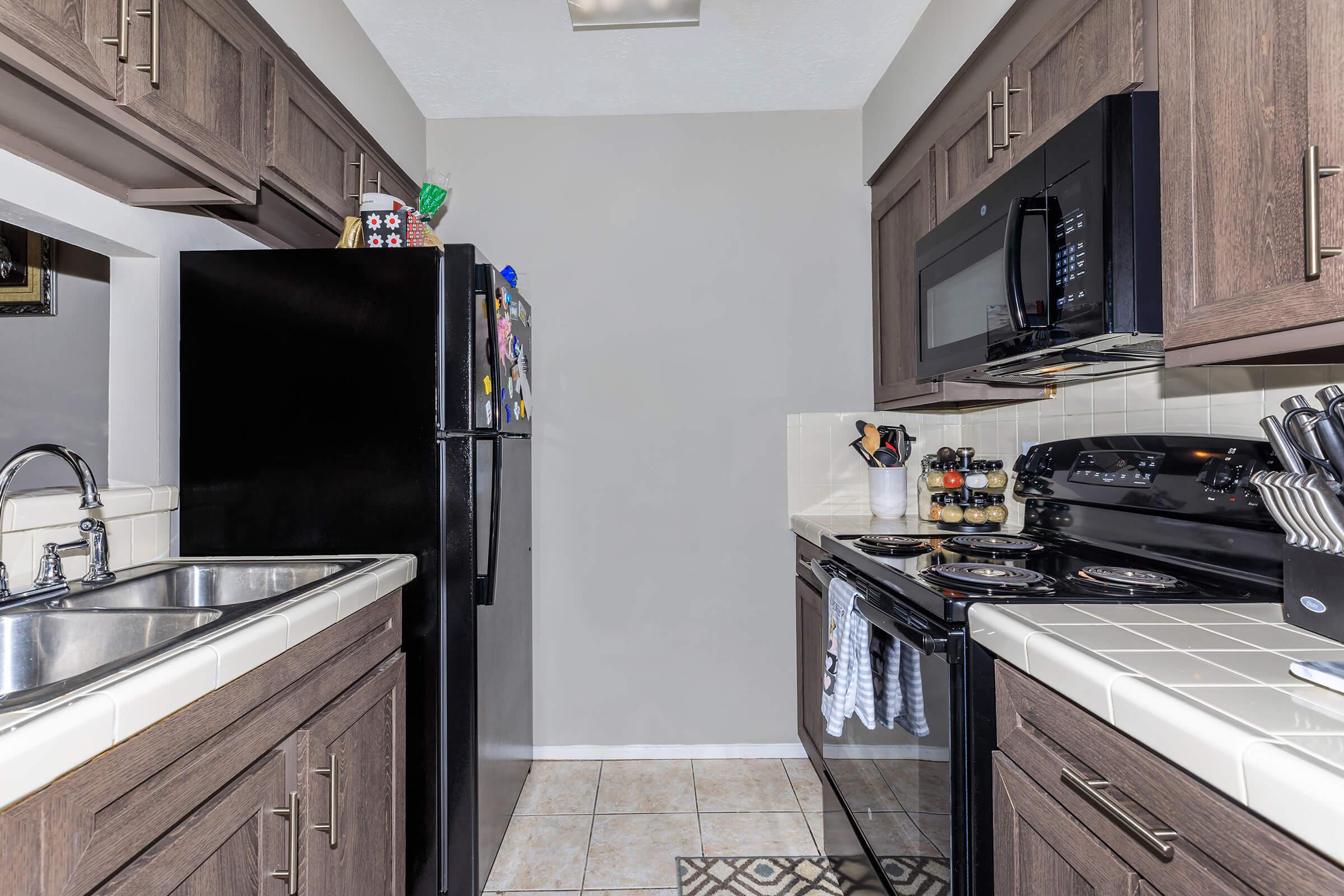 a large kitchen with stainless steel appliances