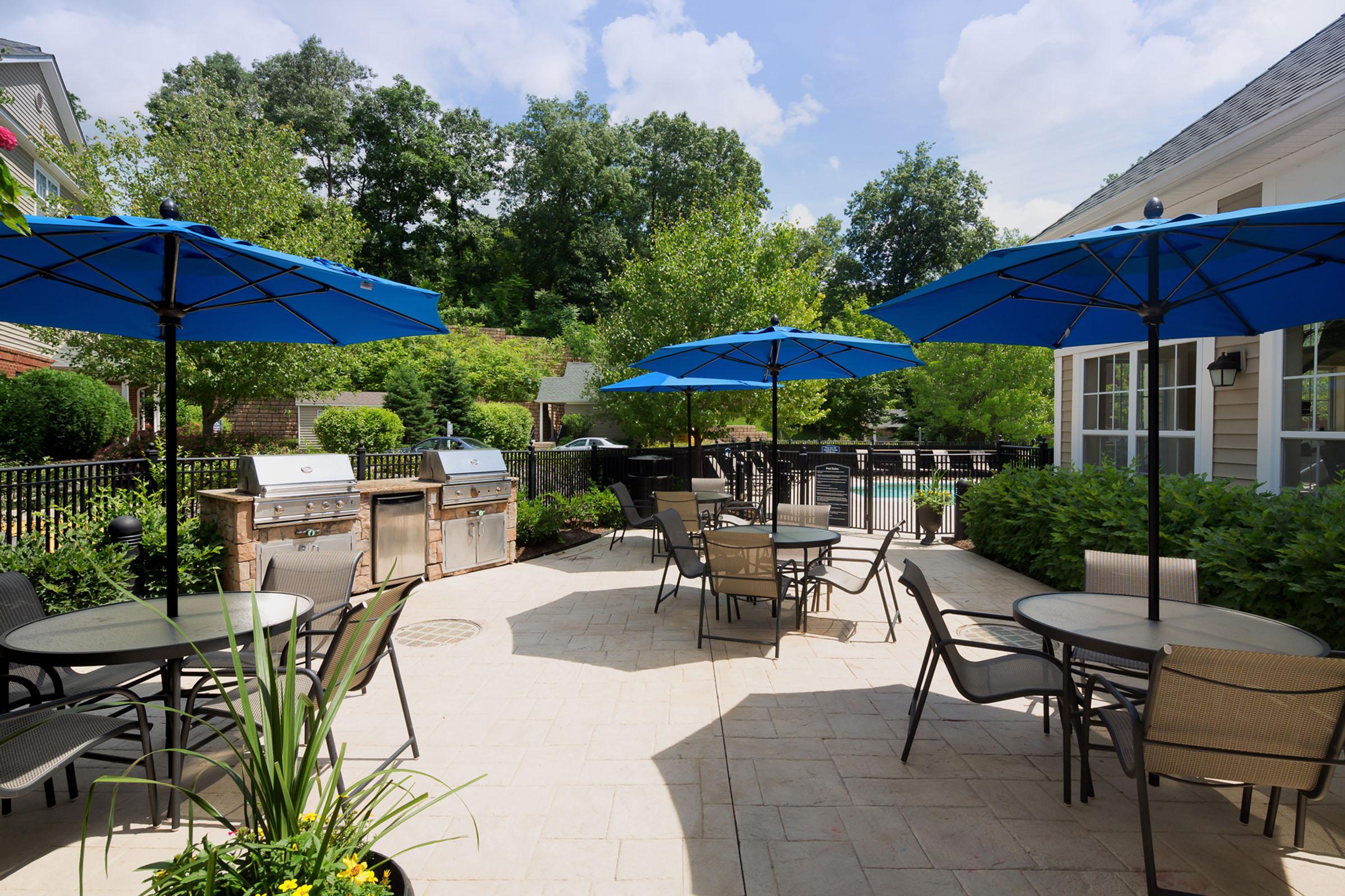 a table topped with a blue umbrella