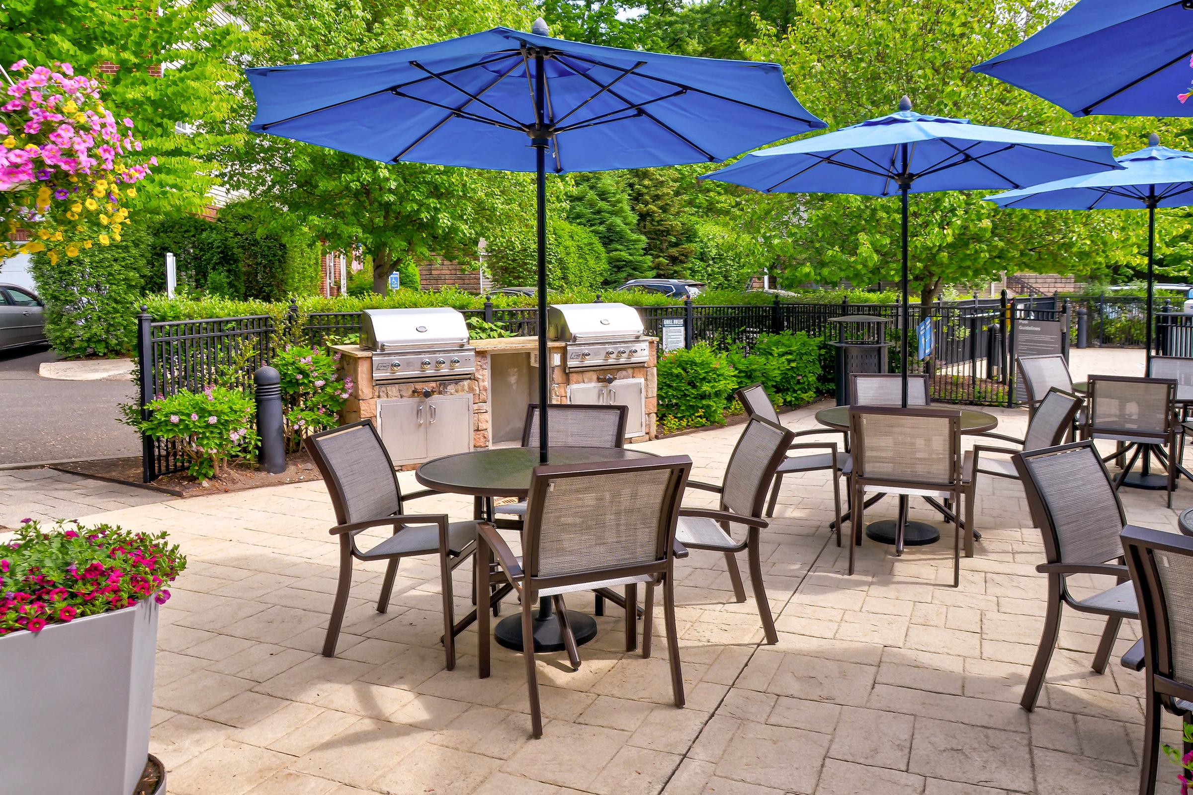 a group of lawn chairs sitting on top of a picnic table