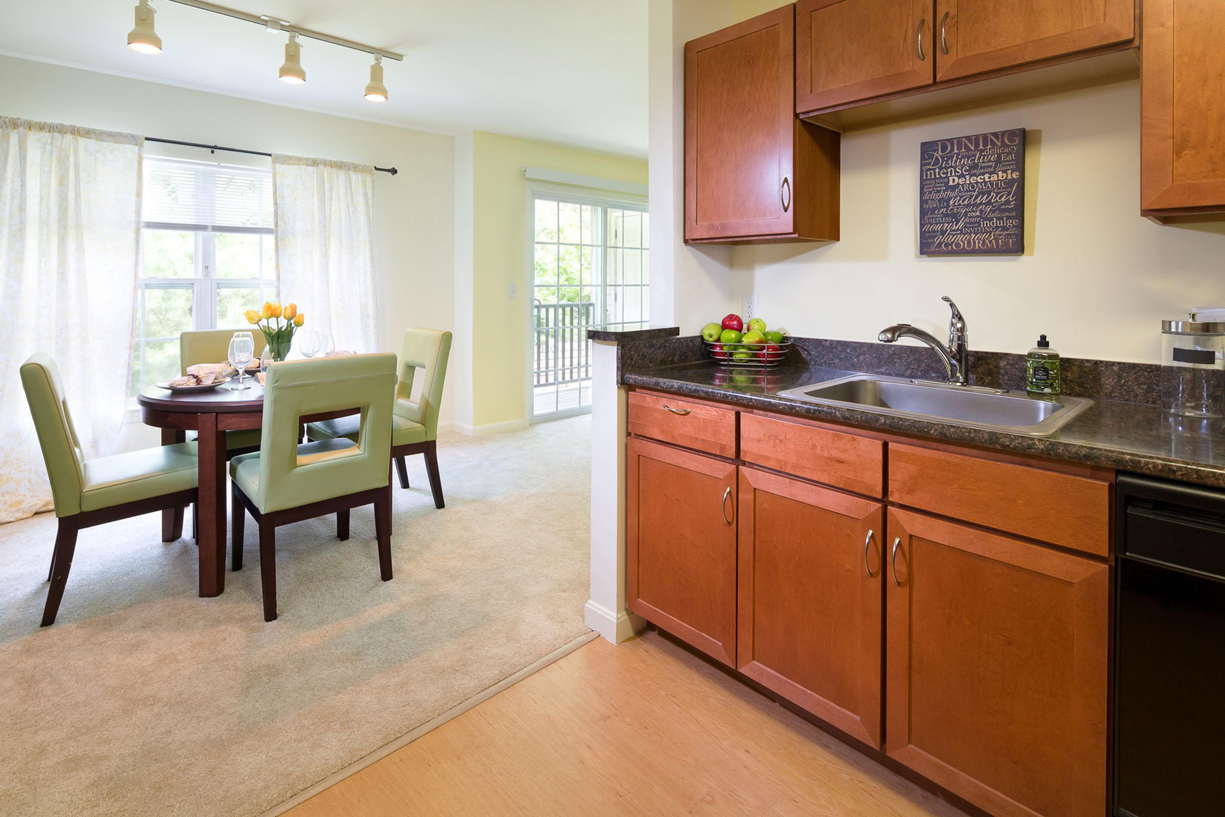 a kitchen filled with lots of furniture