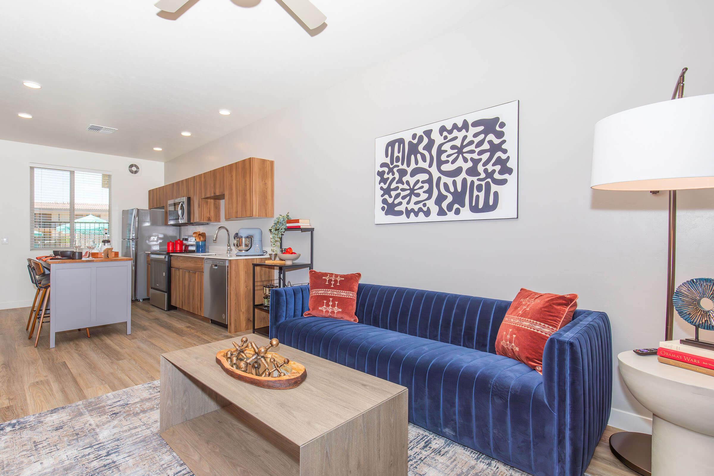 a living room filled with furniture and a table