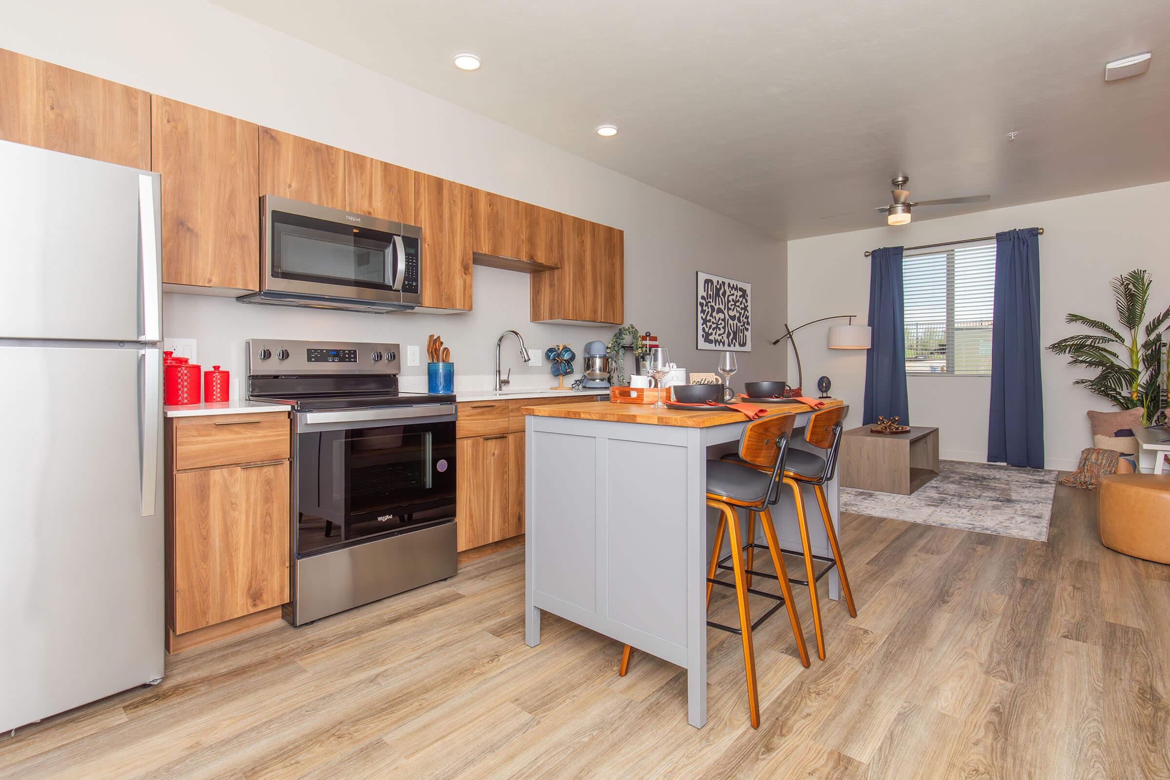 a kitchen with a wood floor