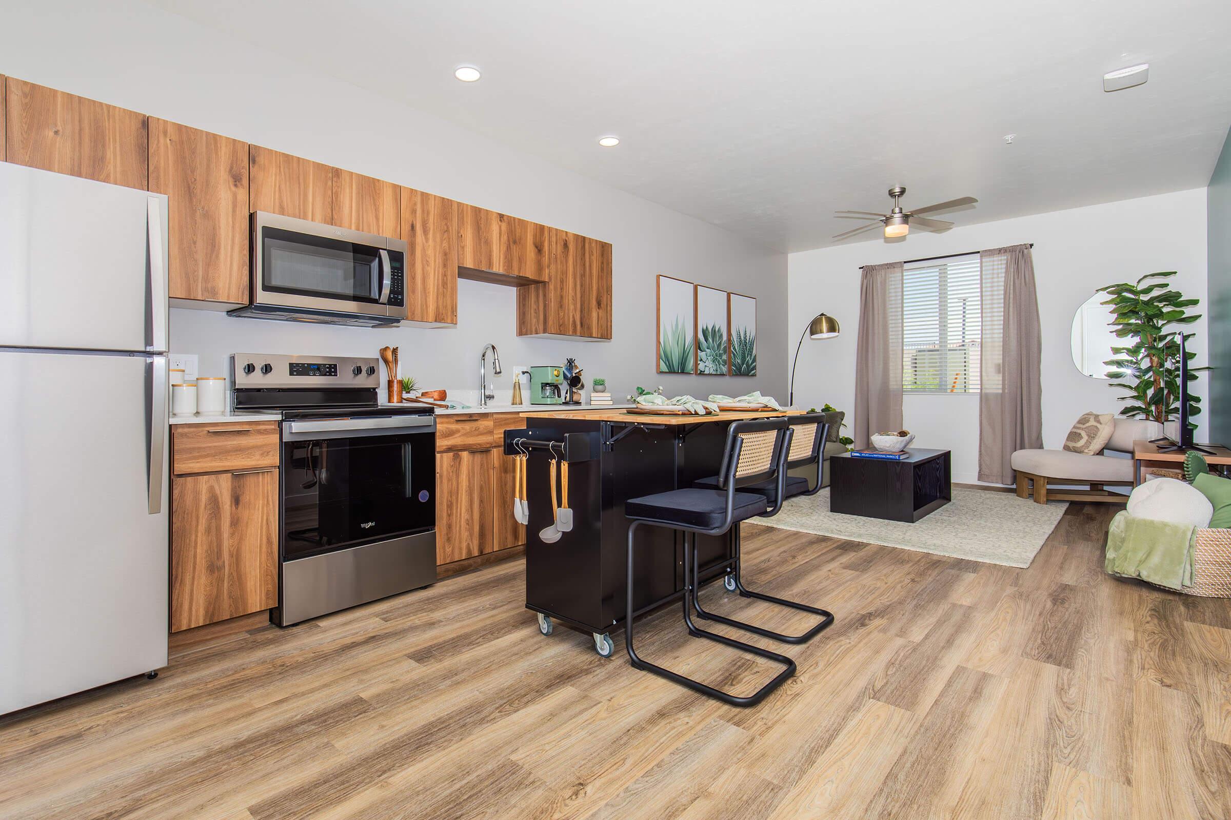 a living room filled with furniture and a tv