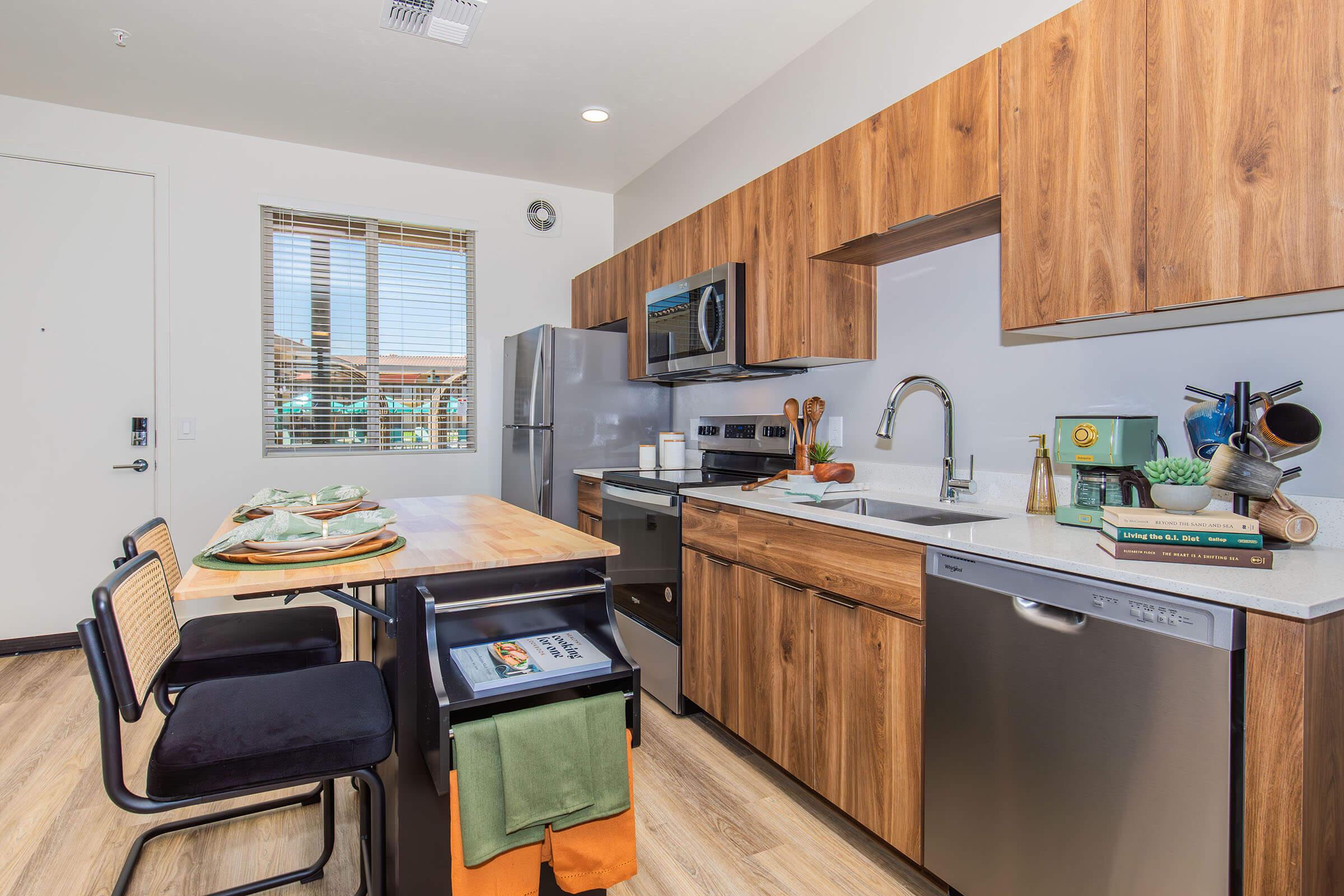 a kitchen with an island in the middle of a room