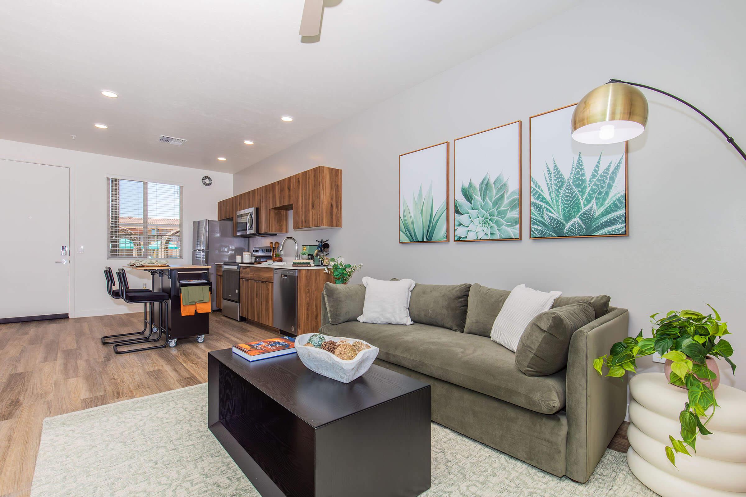 a living room filled with furniture and a flat screen tv