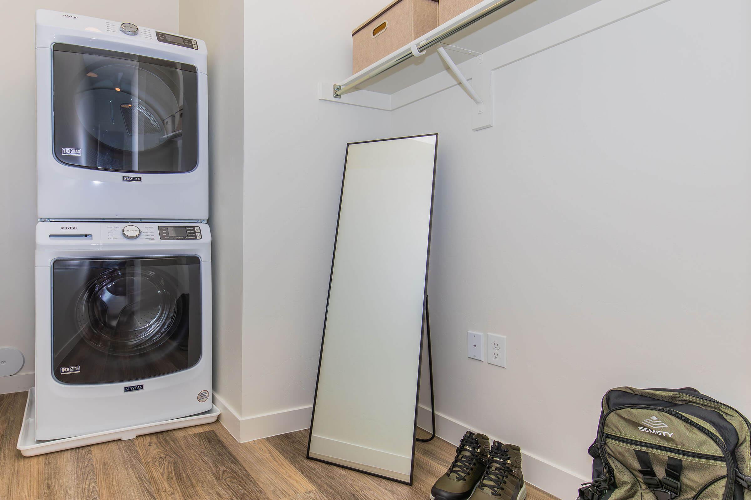 a microwave oven sitting on top of a refrigerator