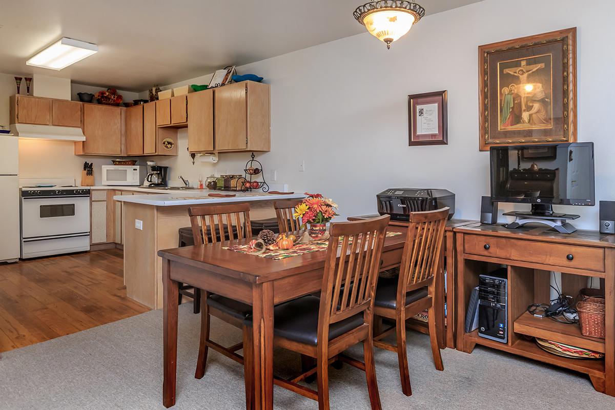 a kitchen with a table in a room