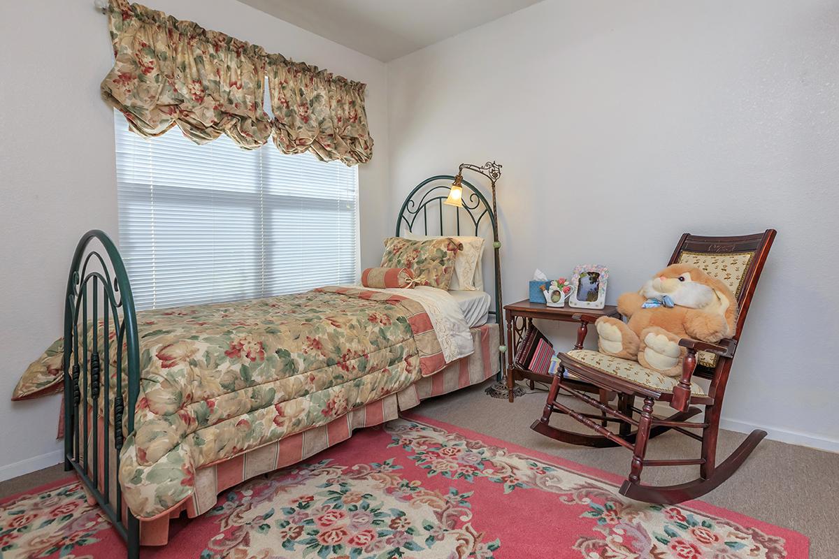 a living room filled with furniture and a rug