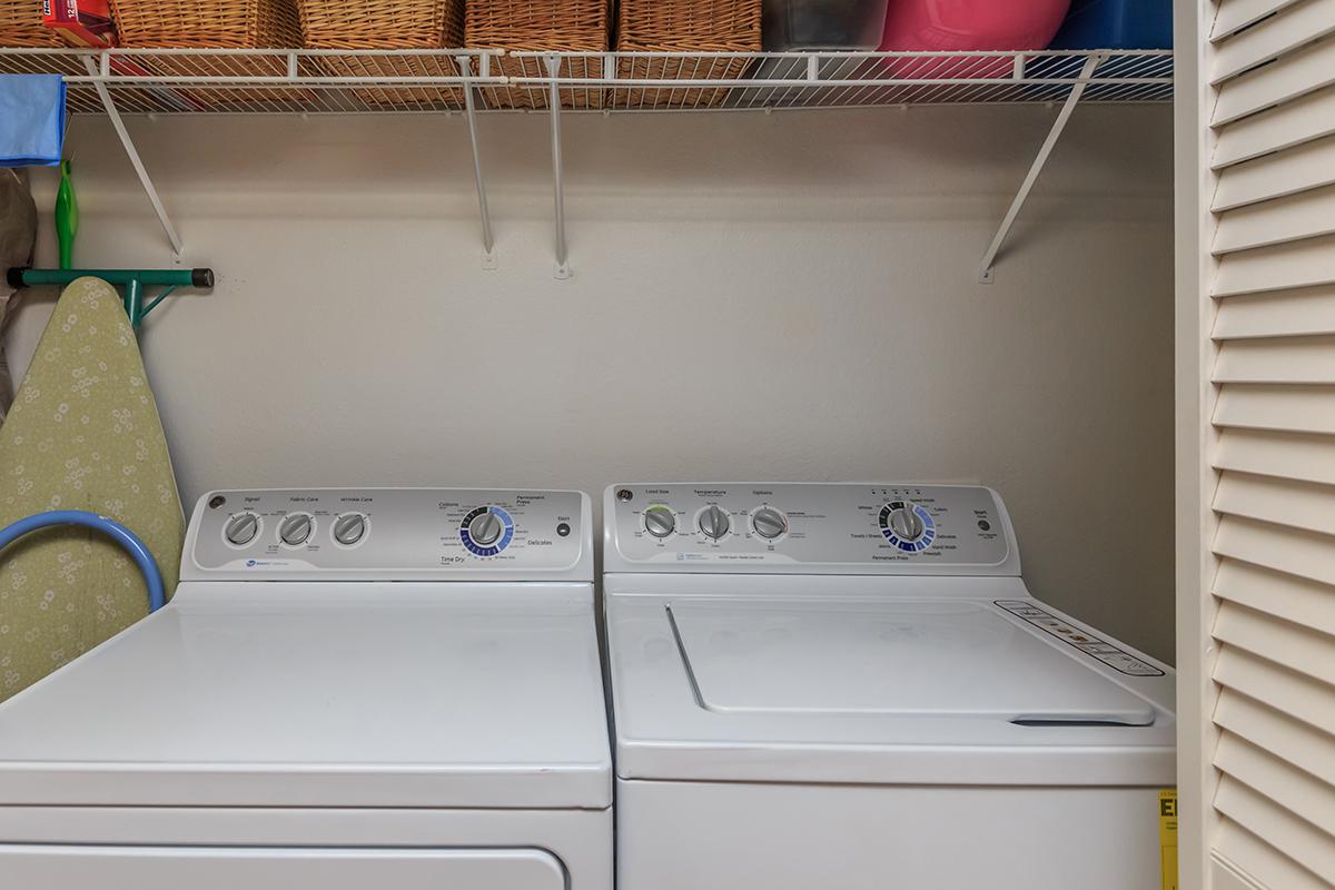 a white stove top oven sitting inside of a kitchen