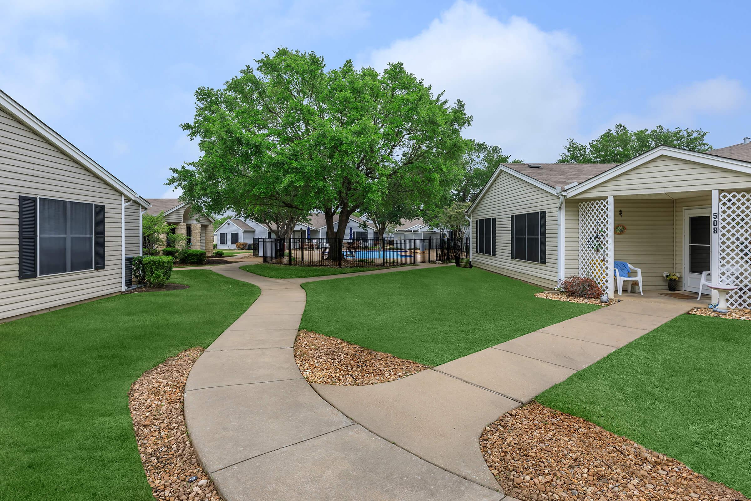 a large lawn in front of a house