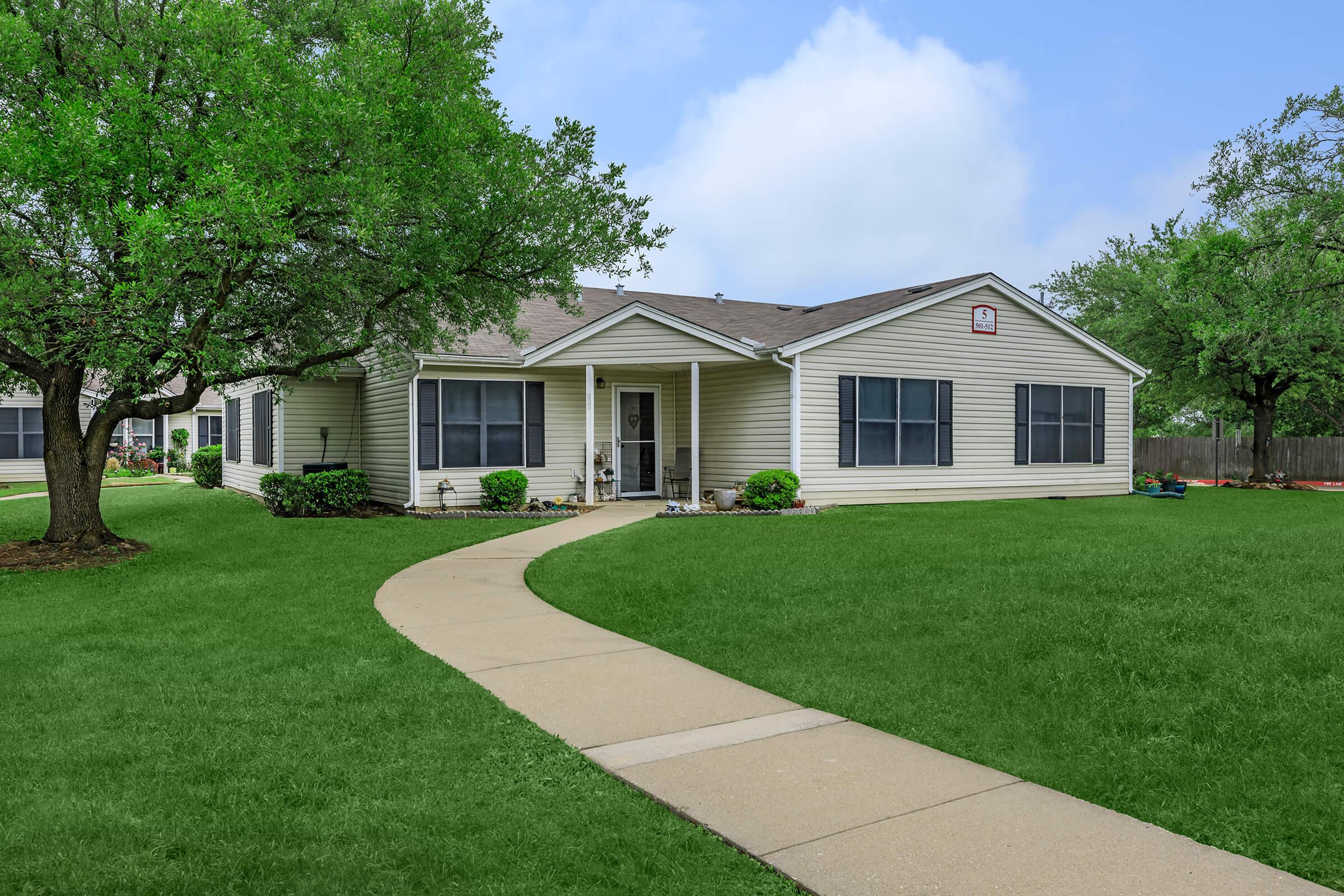 a large lawn in front of a house