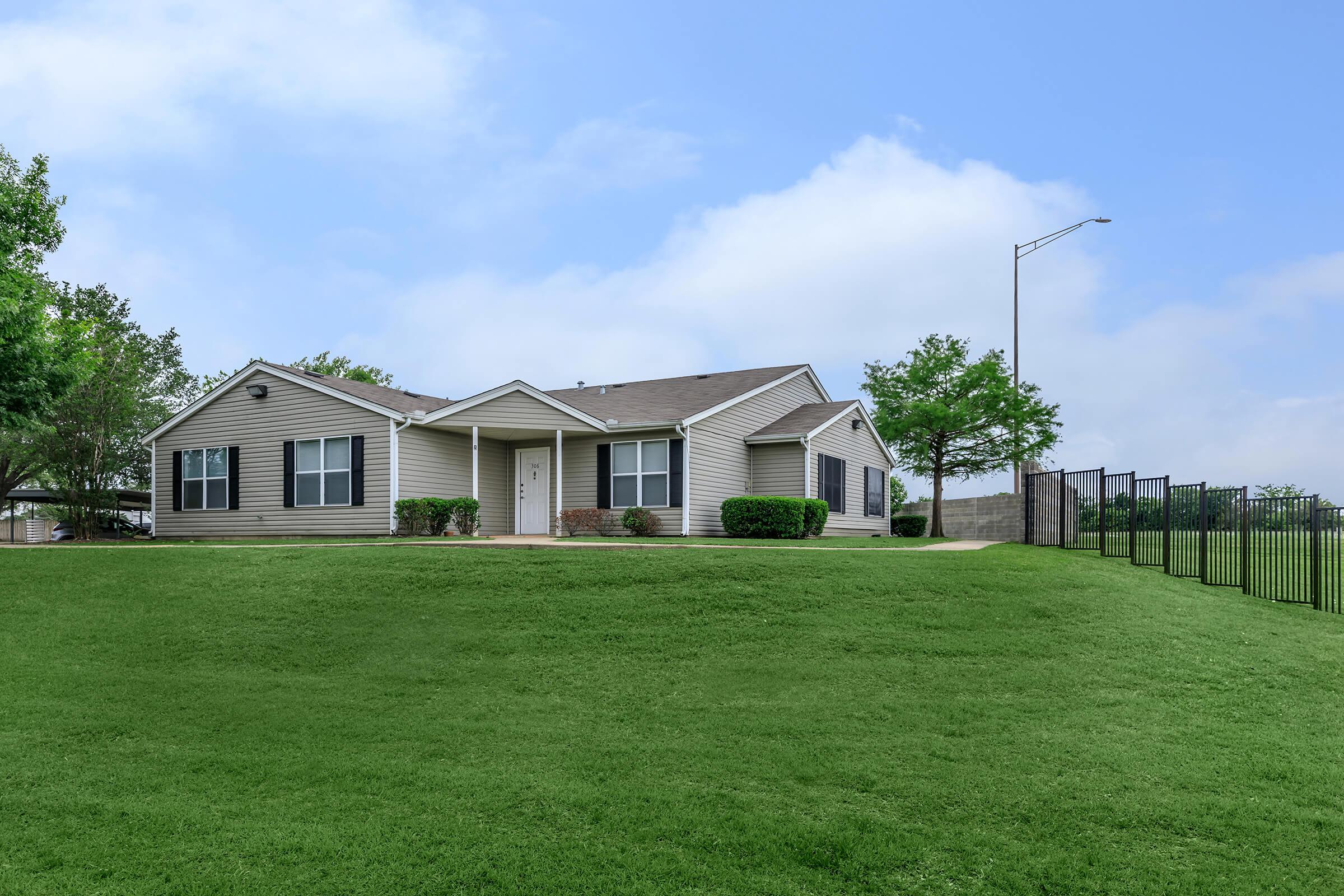 a large lawn in front of a house