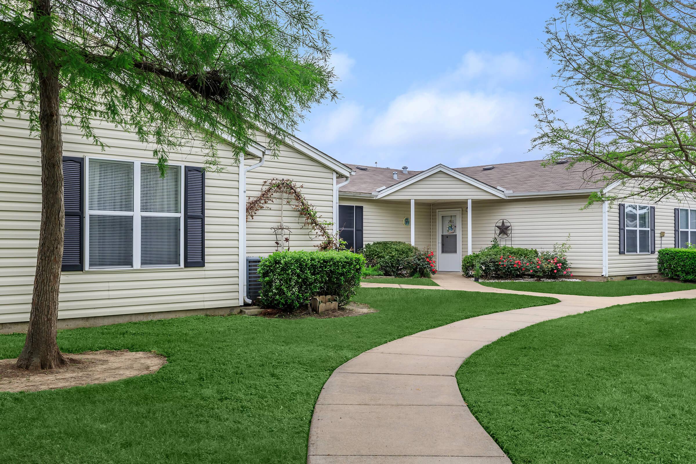 a large lawn in front of a house