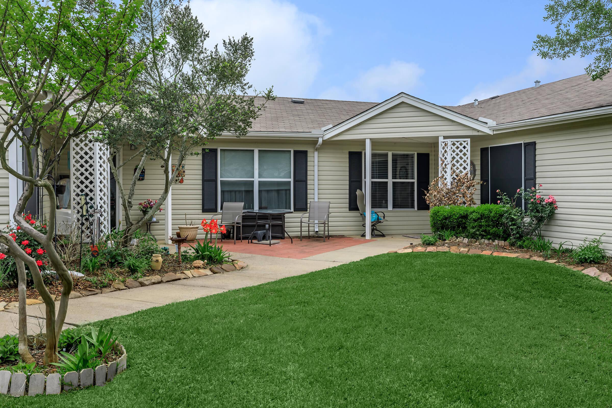 a large lawn in front of a house