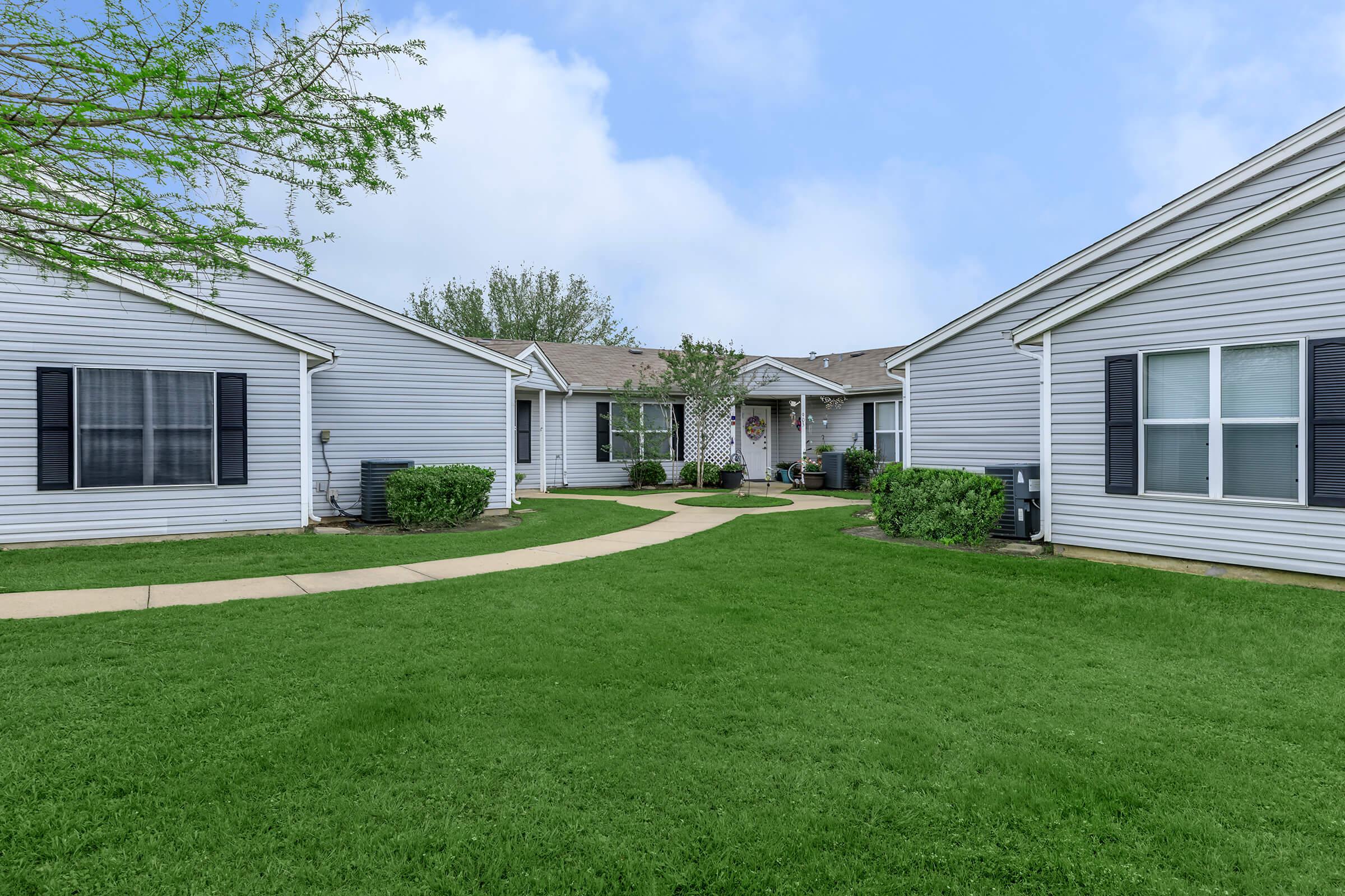 a large lawn in front of a house