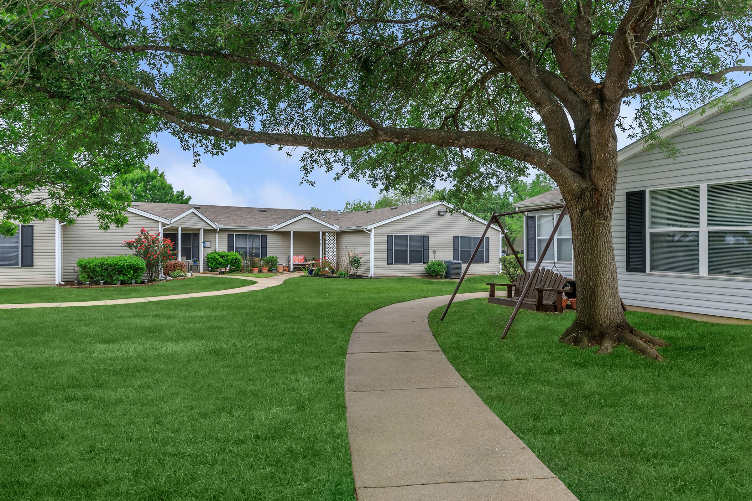 a large lawn in front of a house