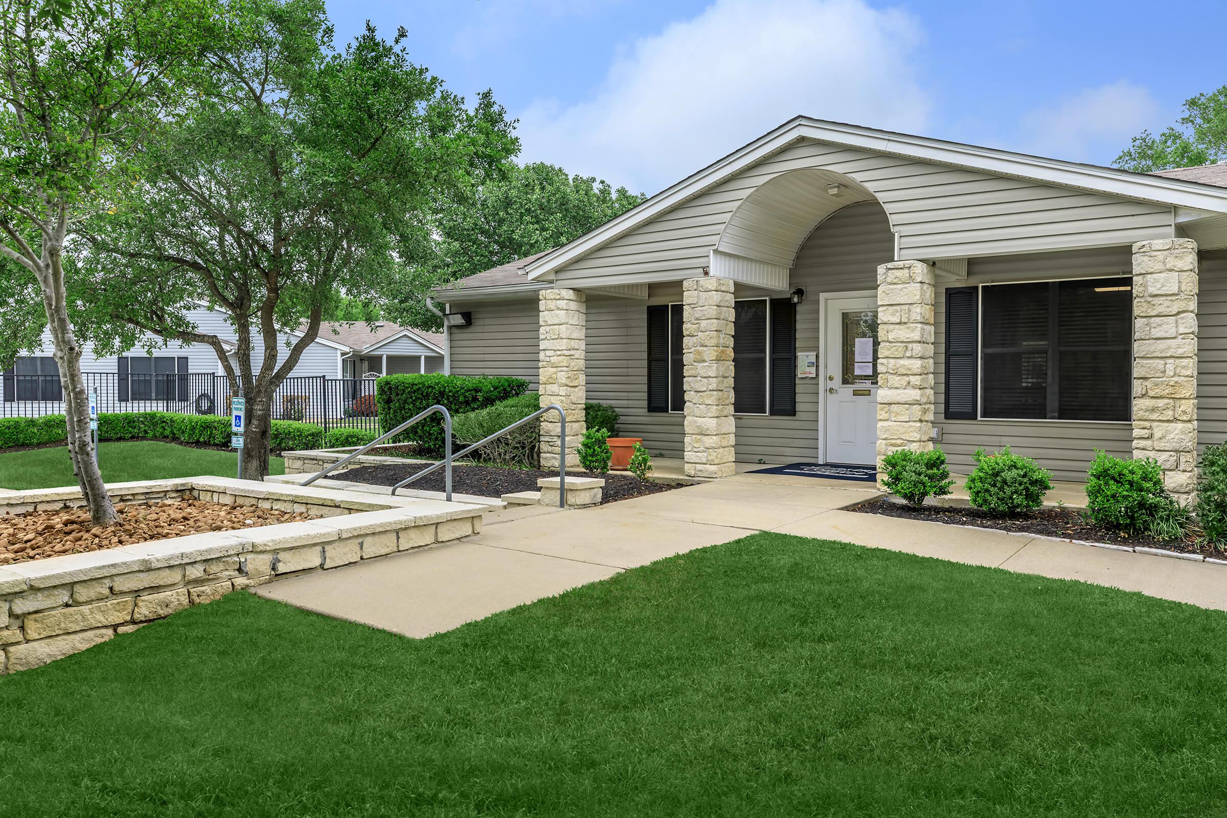 a large lawn in front of a house