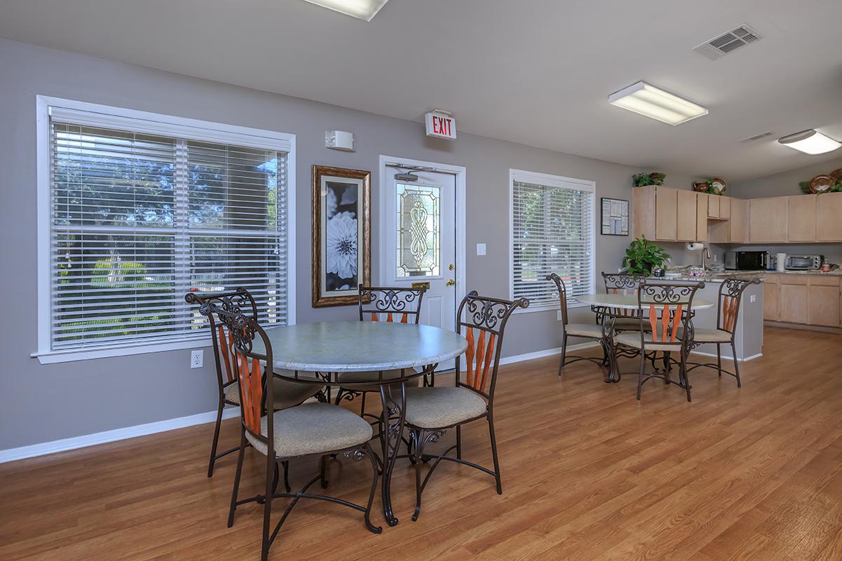 a living room filled with furniture and a large window