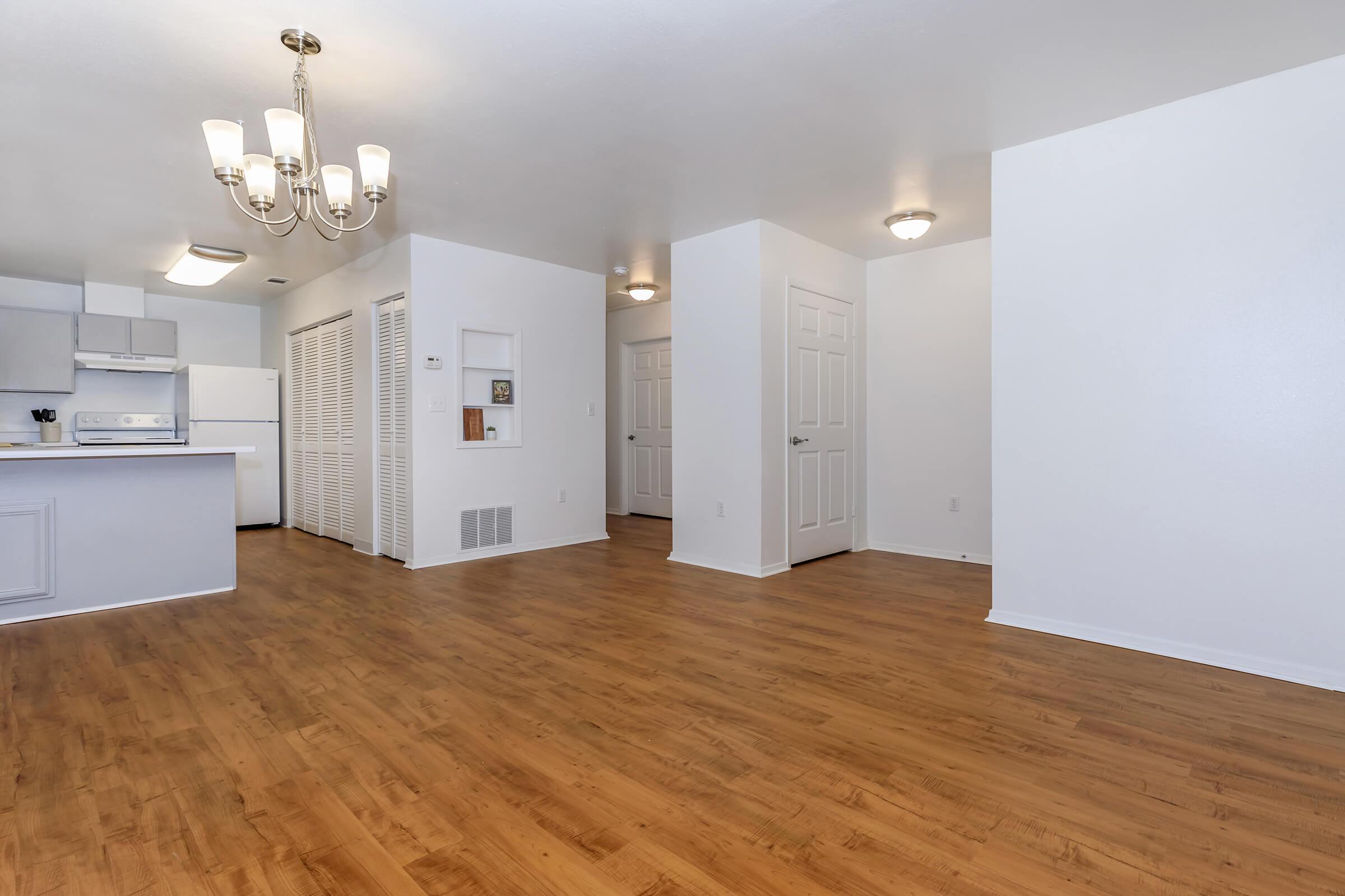 a kitchen with a wood floor