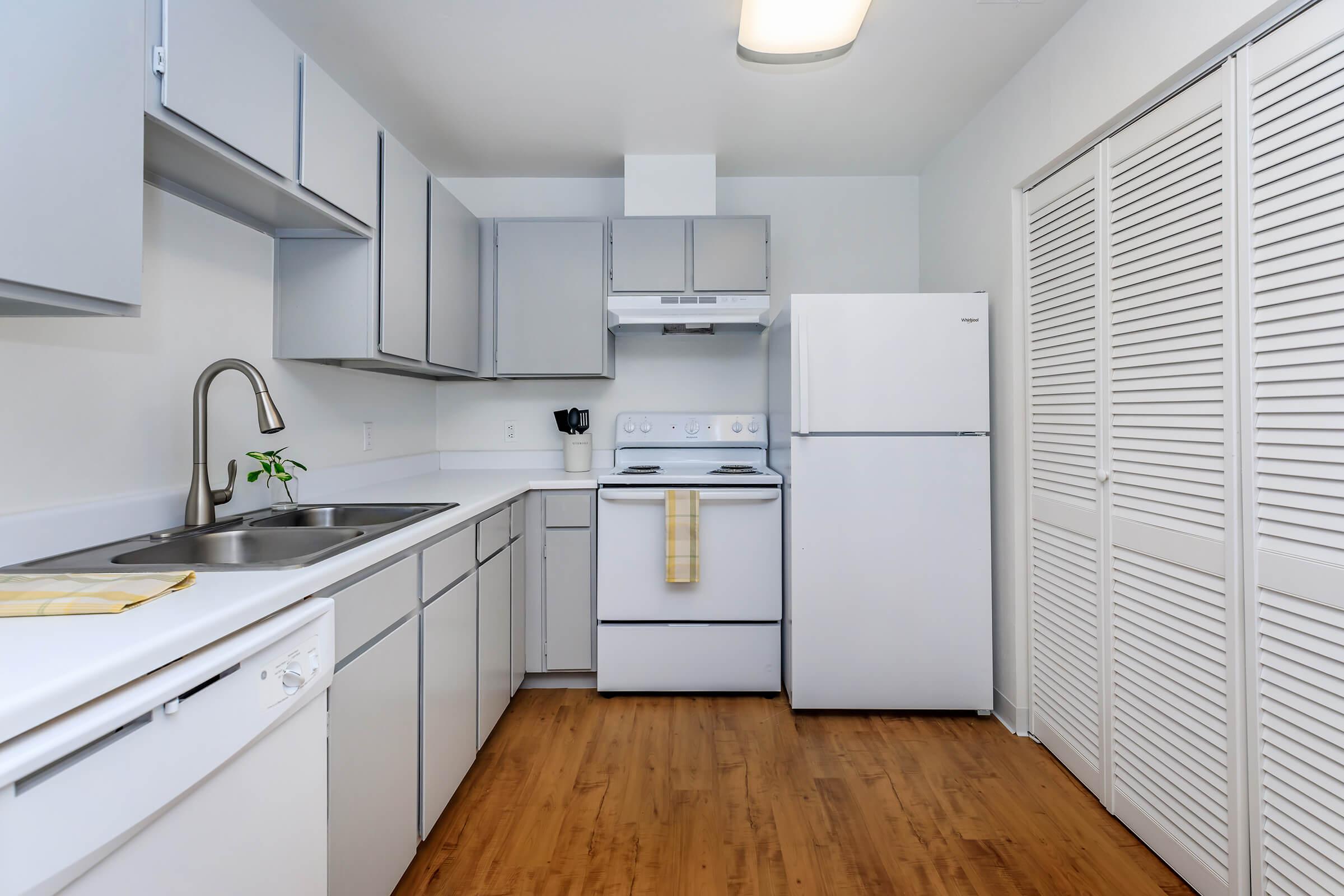 a kitchen with a stove and a refrigerator