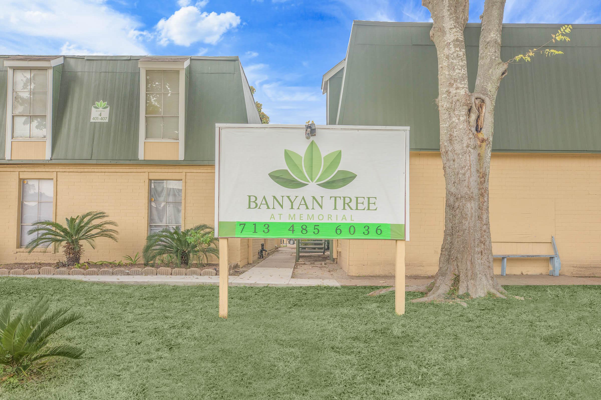 a sign in front of a building
