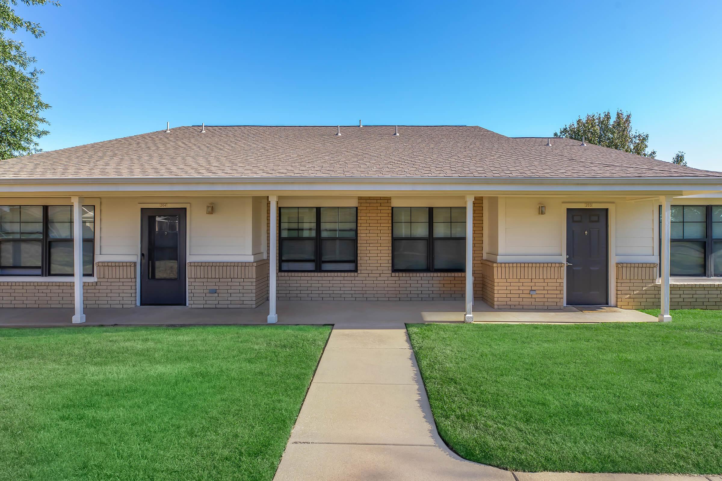 a large lawn in front of a house