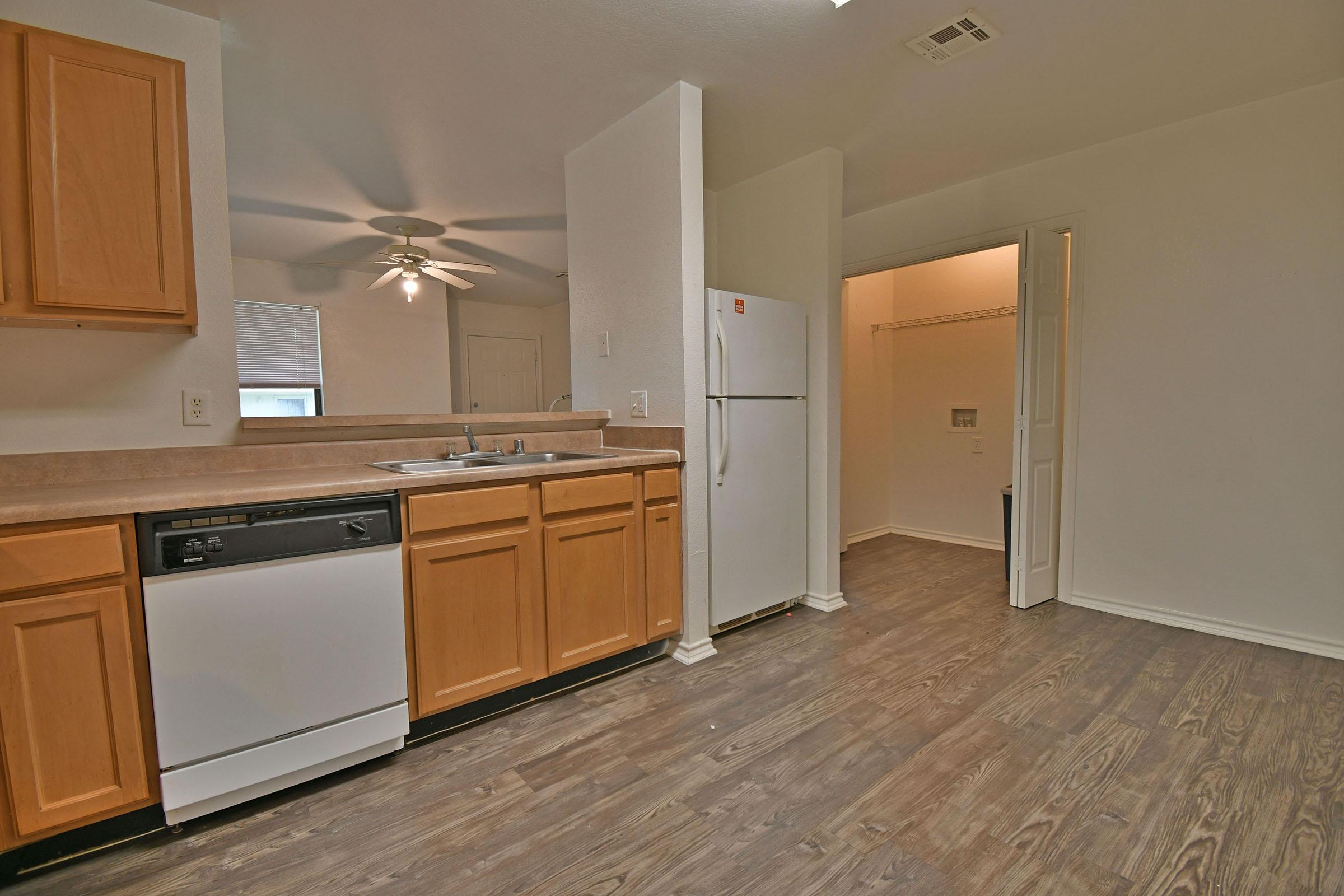 a kitchen with a stove and a refrigerator