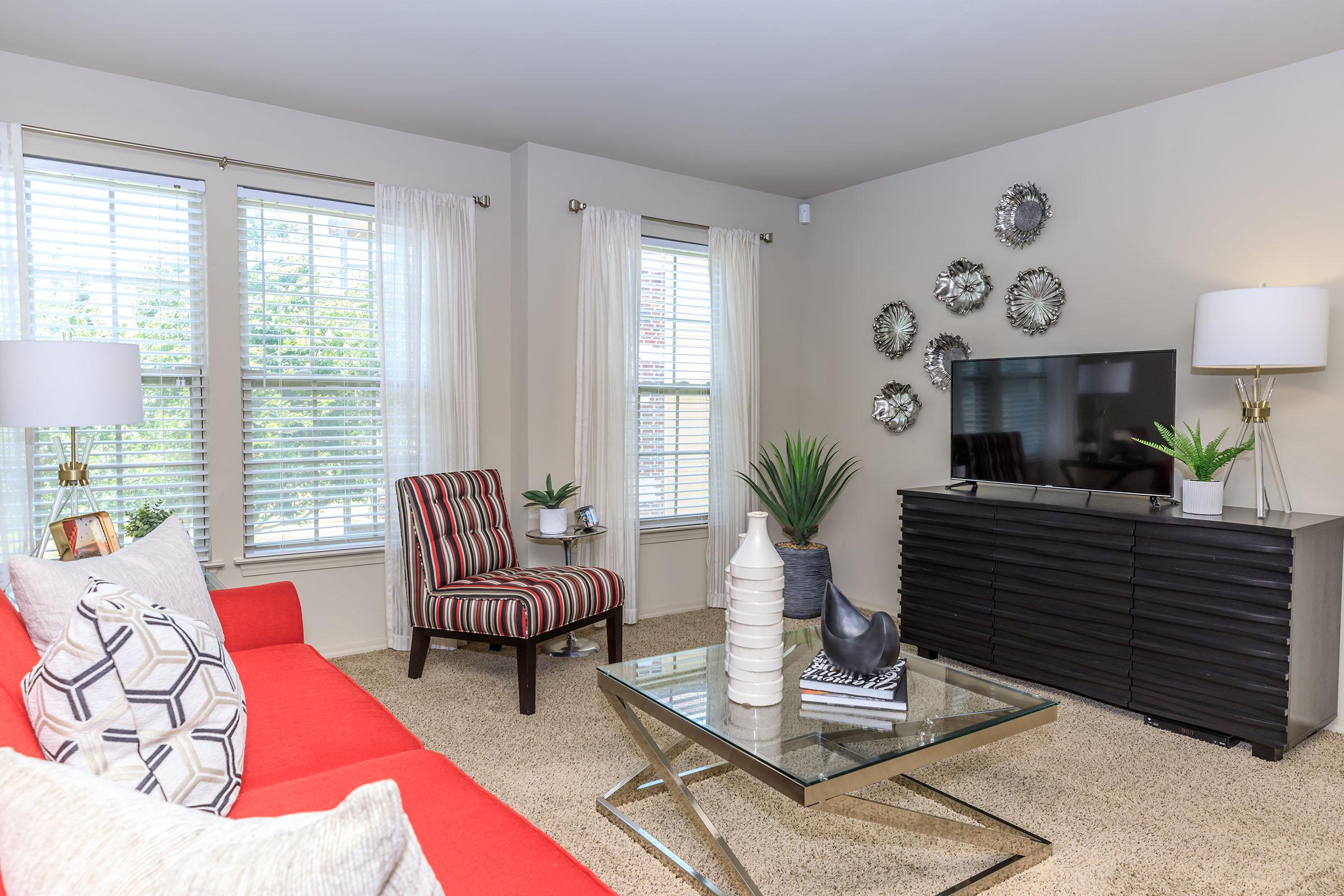 a living room filled with furniture and a fire place