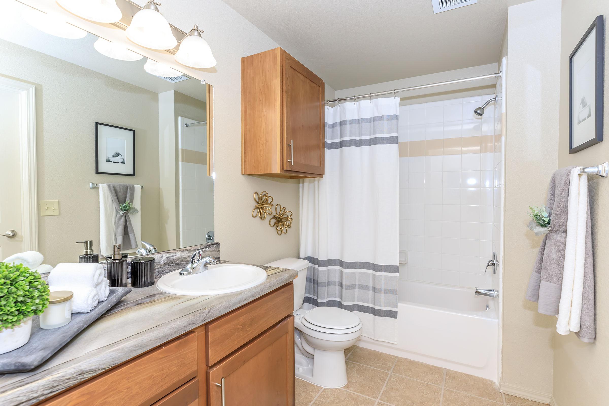 a kitchen with a sink and a mirror