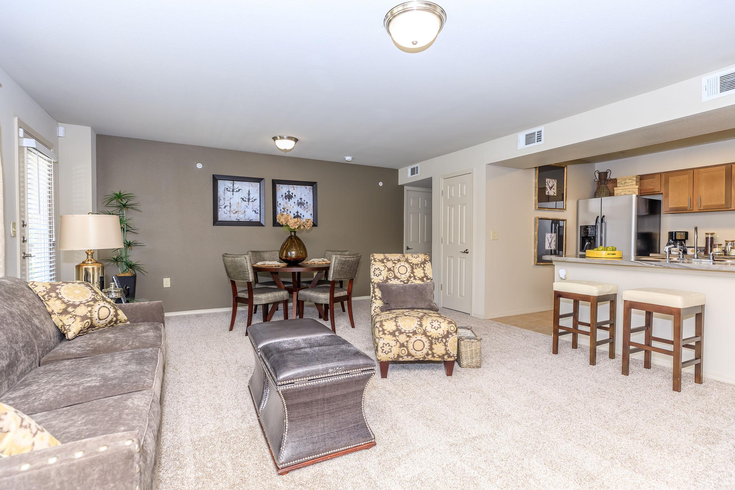 a living room filled with furniture and a fireplace