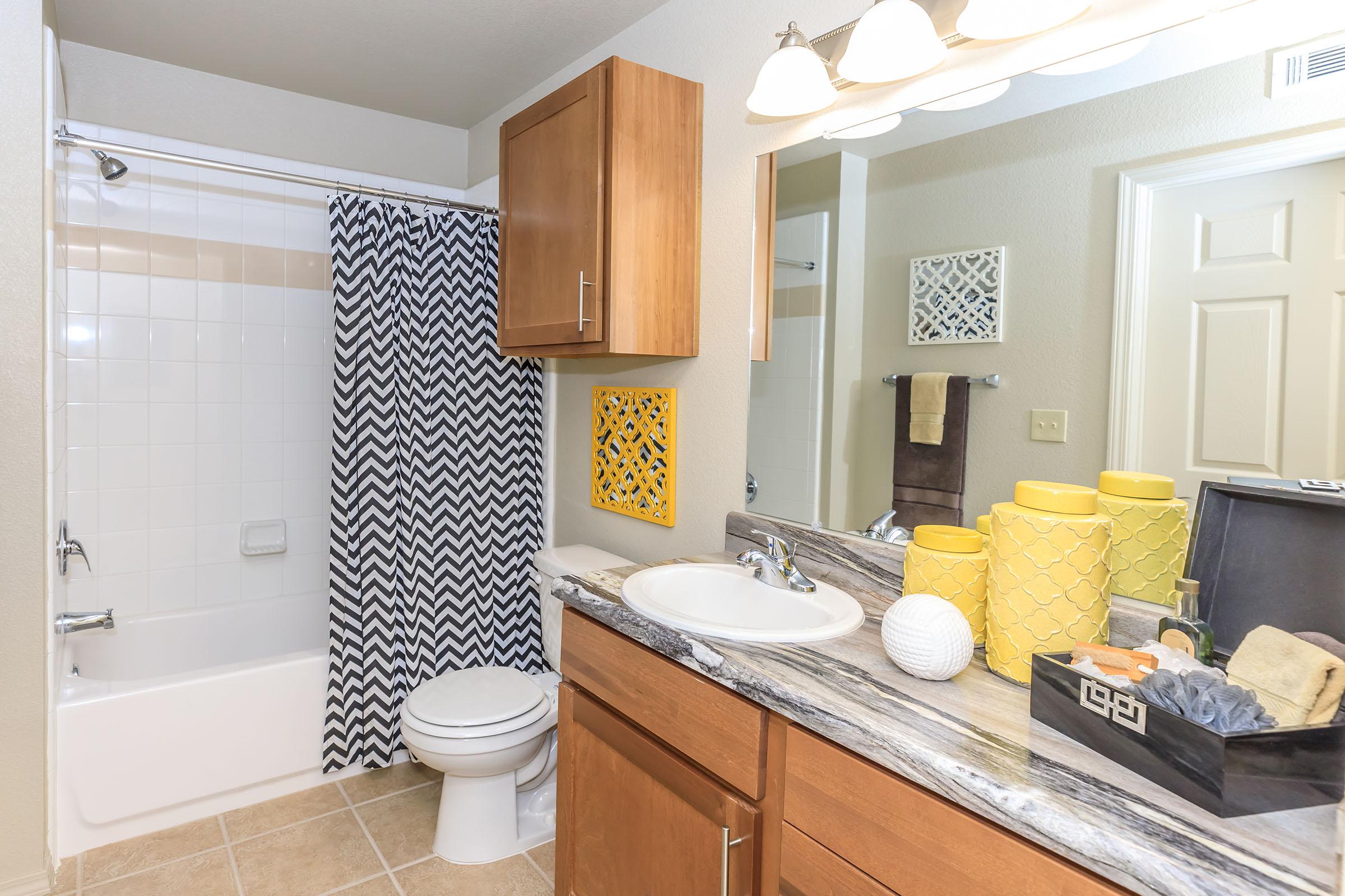 a kitchen with a sink and a mirror