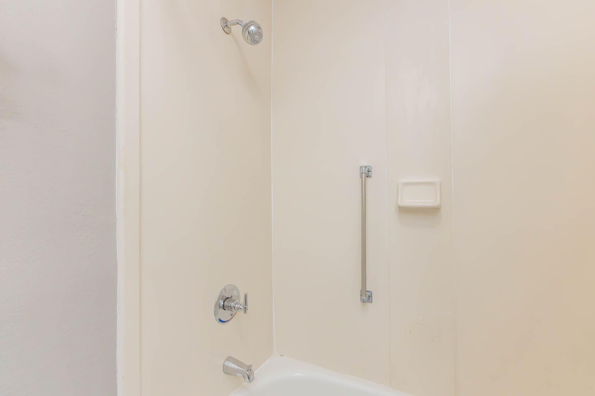 a room with a sink and a shower