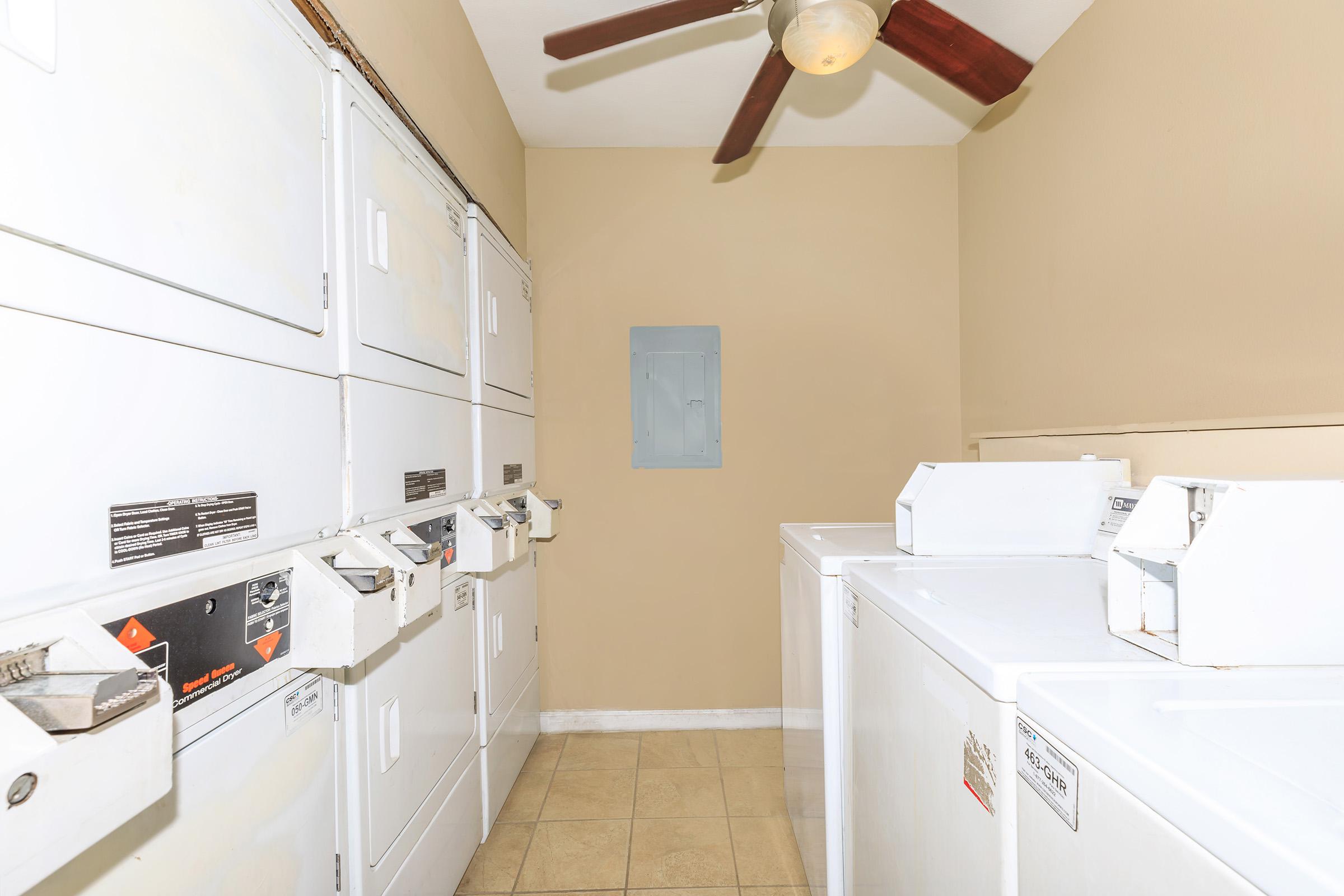 a white refrigerator freezer sitting inside of a kitchen