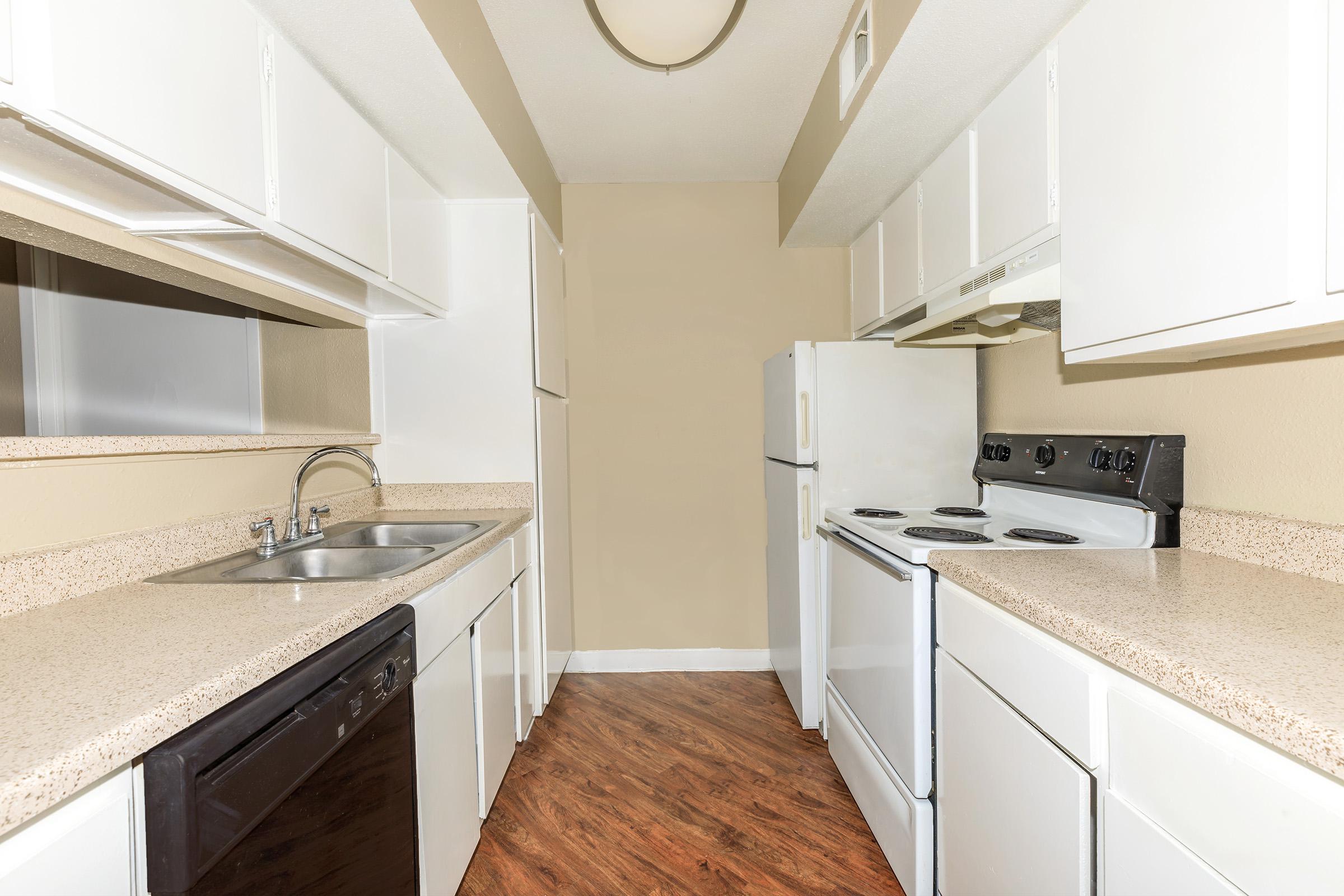 a kitchen with a stove and a sink