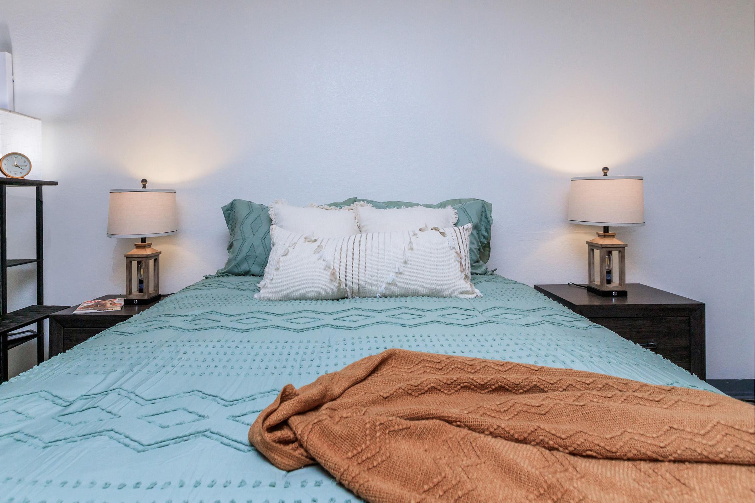 a made bed in a hotel room