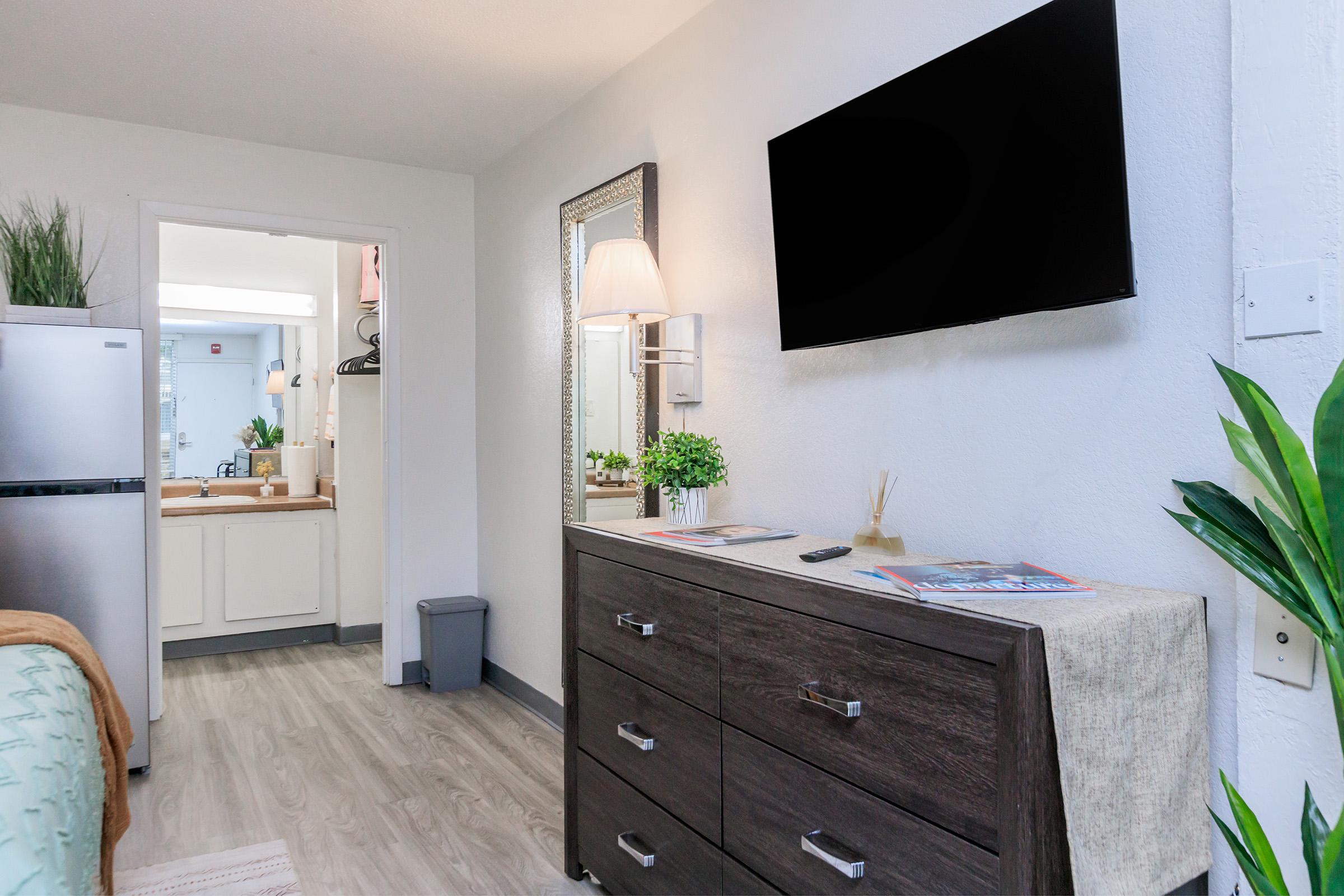 a kitchen with a sink and a mirror