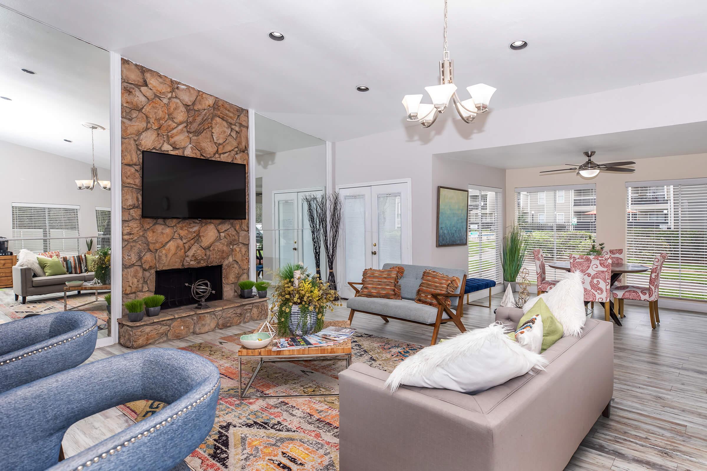 a living room filled with furniture and a fire place